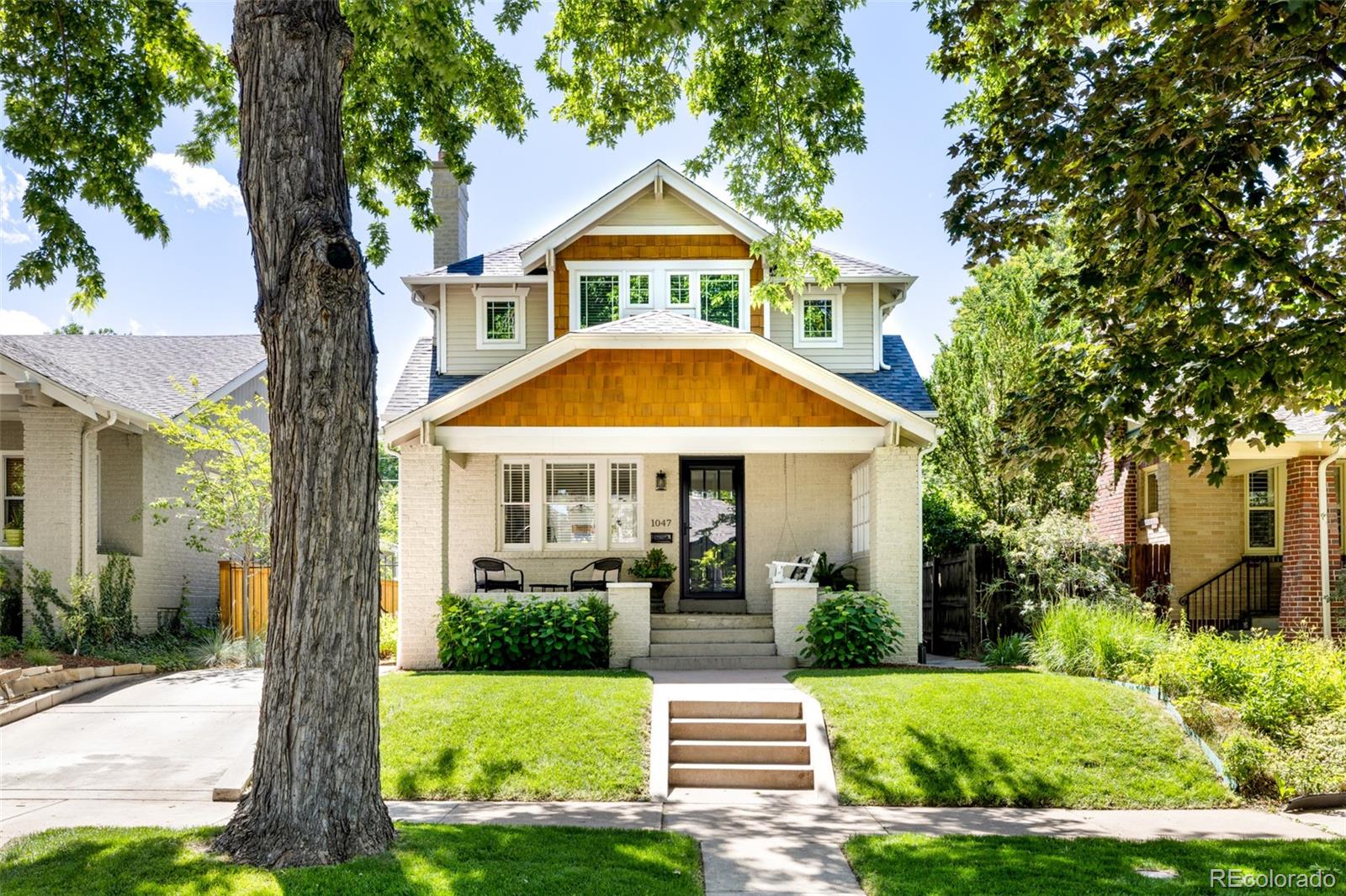 Expertly renovated and full of character, this stunning Craftsman bungalow blends timeless character with modern updates. Bathed in natural light from every angle, the open and versatile floor plan offers seamless connection throughout the main level. Beautiful hardwood floors connect the inviting living and dining spaces to the oversized gourmet kitchen, featuring a large center island ideal for casual dining, plus a tucked-away alcove perfect for a home office. A welcoming front entry with built-in bench seating, storage, and a full bathroom completes the main floor. Upstairs, the vaulted primary suite serves as a peaceful retreat, offering a spacious walk-in closet and luxurious en-suite bathroom. Two additional bedrooms feature charming neighborhood views, generous closet space, and share a beautifully updated hall bathroom with dual vanities and classic finishes.  The basement expands the living space with a cozy recreation room, guest bedroom, full bathroom, and a dedicated laundry room with additional room for storage. Outside, the thoughtfully designed backyard creates a private oasis with a lush lawn, spaces for dining and lounging, and vibrant perennial gardens. Every detail of the interior and exterior has been created to inspire relaxation and enjoyment. Ideally located near the best of Congress Park, enjoy easy access to neighborhood favorites along 12th Avenue, including Blue Pan Pizza, Sienna Wine Bar, Novo Coffee, and more. Just minutes from 9+CO, offering dining, shopping, entertainment, and everyday conveniences. This exceptional home on Steele Street is a rare opportunity to enjoy classic Denver charm in one of the city's most beloved neighborhoods.