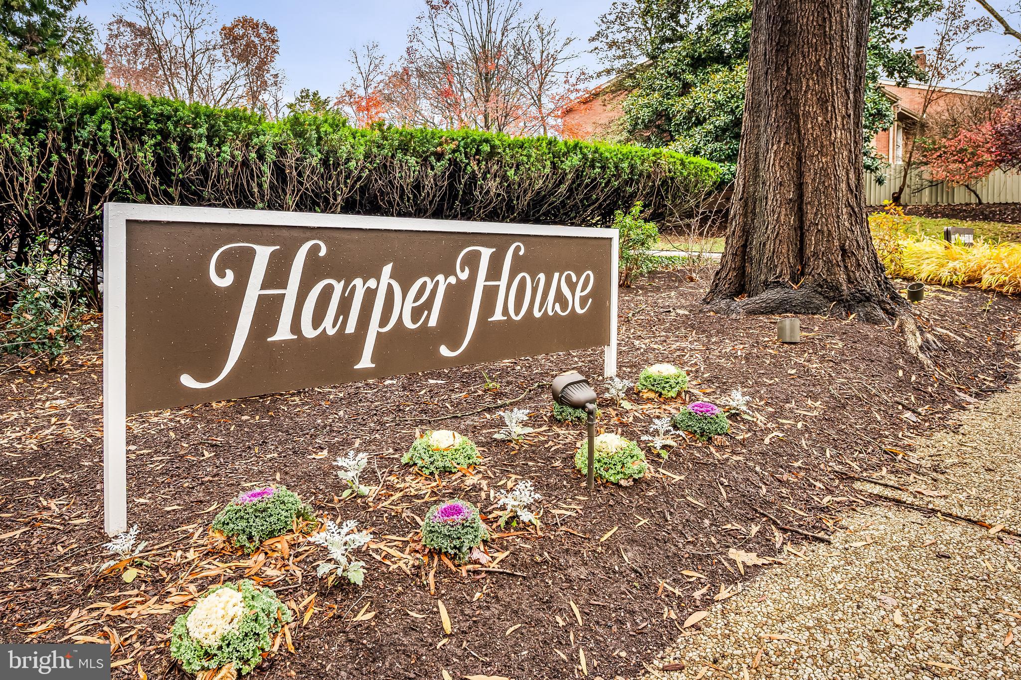 New year, new home.......Cross Keys is hot, hot, hot and living at Harper House is easy, easy, easy - it's a winning combination!Welcome to this bright, freshly painted 2-bedroom, 2-bath condominium  offering expansive living space through the living room, dining room and den area, all with hardwood floors. Featuring  a beautifully renovated kitchen with stainless steel appliances, white cabinets and white counters adjacent to a generously sized dining area with custom built-ins.This unit offers two large bedrooms, two tastefully renovated full baths, full-sized washer and dryer, an abundance of natural light and western facing balcony from which to enjoy sunsets. Enjoy the convenience of all-inclusive condo fees in this full service building along with 2 garage parking spaces, additional storage and a 1st floor  guest suite available for rent.  Cross Keys offers 3 community pools, walking paths, security and ever increasing shops and restaurants. and is ideally situated for quick access to downtown Baltimore, I-83 and other local amenities.