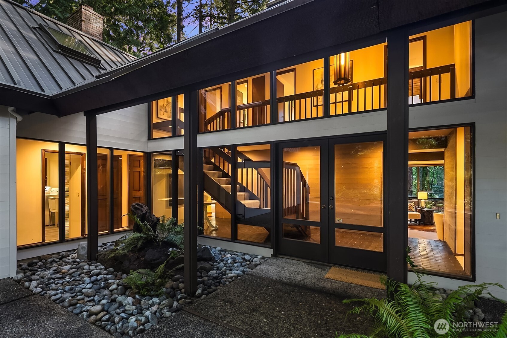 True authentic ‘1970’s Pacific Northwest Contemporary Architecture’, this exceptional home reflects the era’s hallmark principles: clean lines, natural materials, seamless indoor-outdoor living, and thoughtful connection to surroundings. Never before on the market. At the end of a private lane, the lush, arboretum-like setting is the essence Mercer Island Northwest lifestyle. The 17,400+ SQFT lot offers privacy, usability, flat driveway, partial-level yard, charming brick patio, pathways, gardens and expansive decks overlooking private landscape; ideal setting for outdoor living, entertaining, and enjoying nature. The 3100 SQFT floor plan is exceptionally designed for comfortable living and flexibility for today’s lifestyles. There are 5 bds,  private decks, great room, formal living and dining rooms, dedicated office / den , 3 Fireplaces and oversized garage and wood-shop.  Located in desirable, Mid-Island near Ellis Pond, this home combines convenience with a peaceful residential atmosphere. As original owner and stewards of this property , this home has been impeccably maintained and thoughtfully preserved, offering a rare opportunity to own an authentic piece of PNW architectural character. (Pre-inspection available upon request after visiting property.) PLS park in driveway only – DO Not PARK/BLOCK NEIGHBORS’ DRIVEWAYS / PRIVATE RD SE 50TH -PROPERTY HAS LRG DRIVEWAY. IF DRIVEWAY FULL, PARK AT YESHIVA HIGH SCHOOL (90TH ) DURING NON-OPERATIONAL HOURS. Thank you.