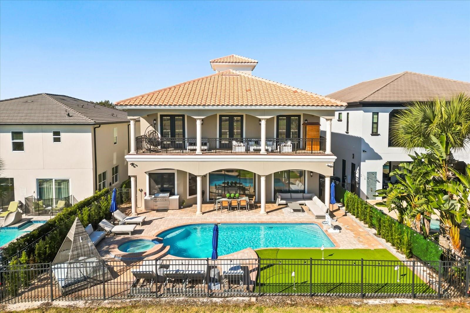 open on 04/12/2026 ***Luxury, lifestyle and legacy is what you will find at Central Florida’s Premier Lifestyle Community, Reunion Resort. Nestled inside the rolling hills of the Nicklaus Golf course you will find a stunning display of character and comfort at 7862 Palmilla Court a Reunion Membership Home.  This FULLY FURNISHED golf course view home is located in the ultra-exclusive Legends Corner, which is one of the most highly desirable portions of the community.  The property radiates curb appeal and stands out from others with recent exterior paint, a freshly pressure washed roof and backyard space that makes you envy of the neighborhood.  Once inside you are greeted with views, design and massive ceiling heights that are hard to miss.  The entire house has been re-imagined from flooring, to paint, and from furniture to fun, and no area has been left behind.  Outdoor space includes new pavers, patio furniture, completely resurfaced pool and spa, including the newly installed Mickey putting green! With this unique floor plan, you will find an expansive first floor open concept that creates multiple gathering spaces.  The front room has oversized windows that let in a ton of natural light and invite you to play a friendly game of billiards. Continuing through the foyer, you will find an area set aside specifically for organized storage. The property also has a unique home office feature for those who need a quiet space to take care of the business of the day or to steal a little computer time.  The lure of the golf course and patio view pull you through the home into the living space and dining area.  You will find a bright and airy kitchen with a private wine closet and pantry with new updated modern appliances, fresh cabinets and new countertops.  The home has all new flooring and specially designed lighting.  The first-floor oversized master includes a double vanity, soaking tub and large private closet. Once upstairs you are greeted by a gathering space that is perfect for entertaining.  Watching the big game, your favorite family movie or catching up on the weather report at home is easy to do in this property because you will have your very own private in-home theater and multi-purpose media space.  You will also find three additionally professionally designed bedrooms that include all new furniture and flooring.  One of them doubling as a second master with a private balcony perch. Each of the rooms has closet space and a private restroom for occupants. This home just feels different.  There is also a very special room set aside that transports little ones to a magical space that makes them feel like they are amongst the friendly faces of royalty.  The large second floor balcony space spans the width of the home and includes lounging furniture along with a SAUNA and expansive breath-taking views of the 11th hole of the Nicklaus golf course.  It has been called the "perfect spot to hideaway."  From floor to ceiling and from the front door to the first putting green this home awaits!  Home is being sold FURNISHED, garage is finished and includes game room and golf cart parking. Reunion has everything you want in a community including 3 signature golf courses, world class dining, waterparks, lazy river, water slides, firework viewing areas, tree lined streets, dog park, playground, driving range, golf simulator, member events, in-resort shuttle service, and event space. Live the resort lifestyle like a VIP. REUNION