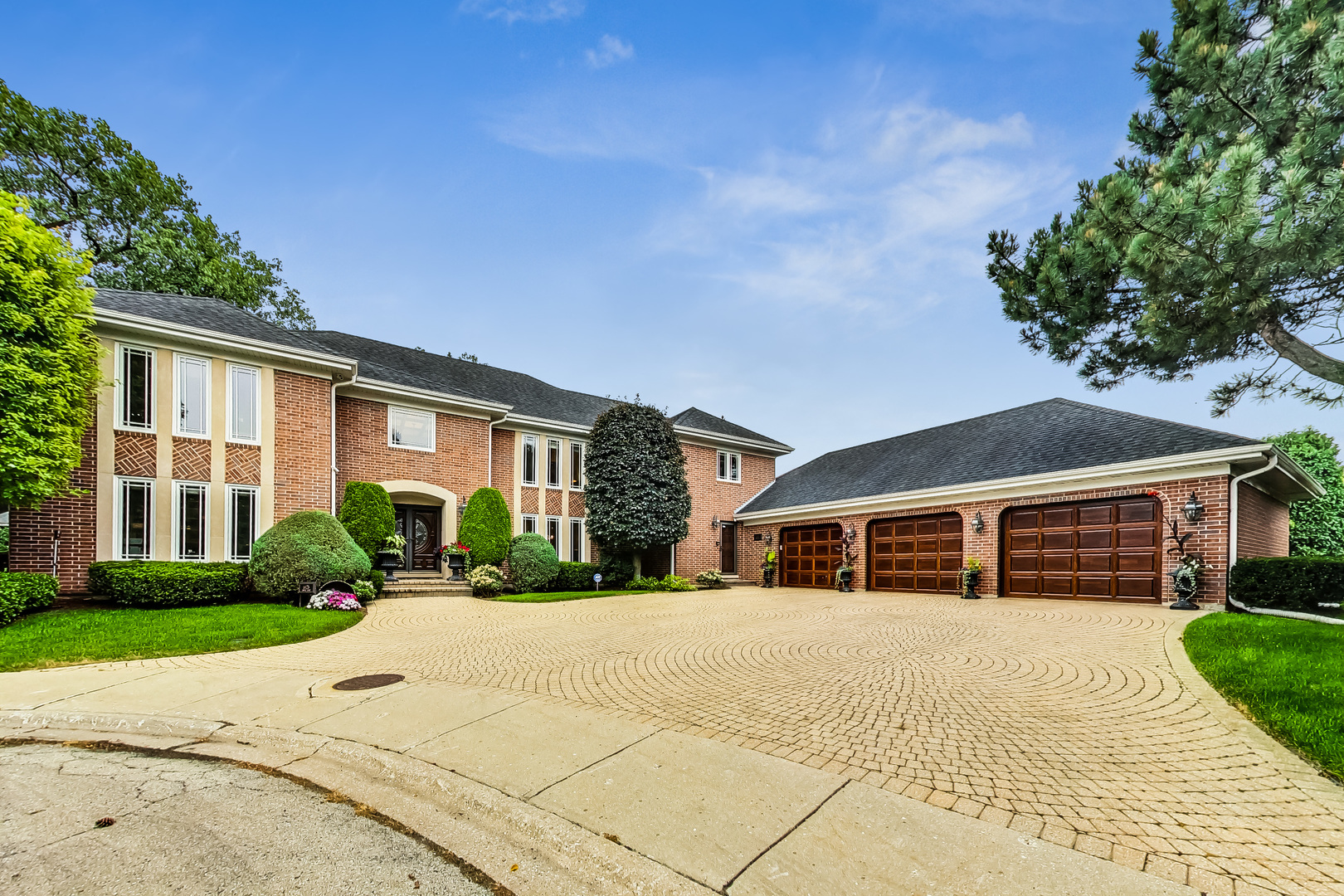 Located in Lincolnwood's premier neighborhood, The Towers, this exceptionally well built, expansive home offers luxury, space, and thoughtful design throughout. The recently updated eat-in kitchen features Wolf and Sub-Zero appliances, granite countertops, custom cabinetry, a butlers pantry and a walk-in pantry. The family room includes a fireplace, warm wood floors, and floor-to-ceiling windows that open to the backyard. A spacious dining room and formal living room are ideal for entertaining. The main level also includes a large mudroom, custom wood-paneled office, and an ensuite bedroom with a walk-in closet and attached bath with walk in shower. Upstairs, the primary suite overlooks the backyard and features an oversized walk-in closet, a spa bath with jetted tub, walk-in shower, dual vanities, and a fantastic sauna. Three more generously sized bedrooms complete this level, including a second ensuite bedroom with two walk-in closets and a hall bath to service the additional spacious bedrooms. The finished basement offers two large rec rooms-one for lounging and one for games and exercise-plus ample storage. Outside, the fully fenced backyard includes mature trees, a grassy lawn, and a large paver patio perfect for outdoor dining. A 3.5-car attached garage completes the home. Tucked on a quiet cul-de-sac near playgrounds, shopping, restaurants, and the phenomenal Lincolnwood Aquatic Center, this home combines comfort, convenience, and luxury in one of the area's most desirable locations just 13 miles from downtown Chicago, making a commute to work or nightlife a breeze.