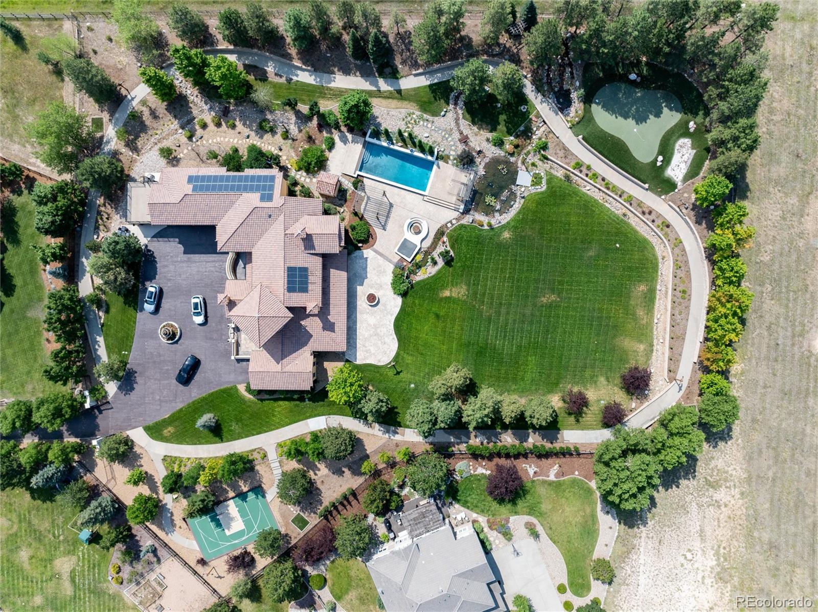 A Mediterranean masterpiece. You will access this private Mediterranean Estate via a gated entry. Hidden in the prestigious Hidden Pointe Estates community of Castle Pines, Colorado, on 2.47 luxurious acres, is a lifestyle beyond your expectations. Soaring ceilings, exquisite arches, and indoor and outdoor balconies accent the grandeur of the over 10,000 square feet of European styling.  Luxurious treed grounds with walking paths, lily ponds, a pool, hot tub, fire pits, a golf putting green, sports court, and unique lighting effects create a magical panorama with the Rocky Mountains as the backdrop. The stained concrete construction of the motor pool entrance with its fountain is mirrored throughout the home, creating an authentic European ambiance. With its top-of-the-line cabinetry and appointments throughout, its timeless construction, the rare main floor private apartment with its own garage (6 total), and extraordinary authentic quality at every turn, this amazing estate is a lifestyle decision, one you will never regret.