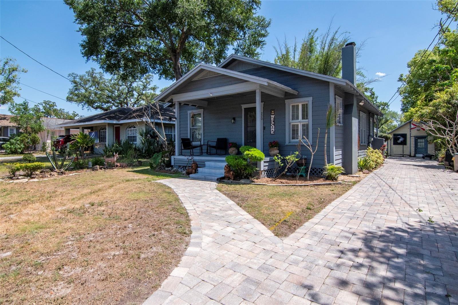 Come see this charming two bedroom, one bathroom bungalow in the highly sought-after Seminole Heights neighborhood, known for its historic character and vibrant local scene. This inviting home blends timeless charm with everyday comfort, featuring original wood flooring in the living and dining rooms, a cozy fireplace, plantation shutters and plenty of natural light throughout. The kitchen offers a warm, rustic feel with Saltillo tile flooring, oak cabinetry, and a bright breakfast nook that overlooks the backyard the perfect spot for morning coffee or casual meals. Both bedrooms are generously sized, and the full bathroom is conveniently located to serve the home’s layout. Step outside to a spacious rear deck designed for entertaining, complete with room for outdoor dining and relaxing. The backyard offers a peaceful, private setting with a charming koi pond that adds to the tranquil atmosphere, the perfect space to unwind or host guests. A detached building adds flexibility with potential for storage, a hobby space, or easily converted into a workshop, game room, studio, or home office to suit your needs. The oversized paved driveway provides ample parking, a rare find in the area.  Be part of an established community with local restaurants, breweries, shopping, libraries, schools, parks (including riverfront Epps Park and Henry and Ola park) and art studios. Seminole Heights is conveniently located in central Tampa with a quick commute to downtown Tampa, hospitals, universities, professional sports venues and easy access to interstates. Make your appointment for a private showing today!