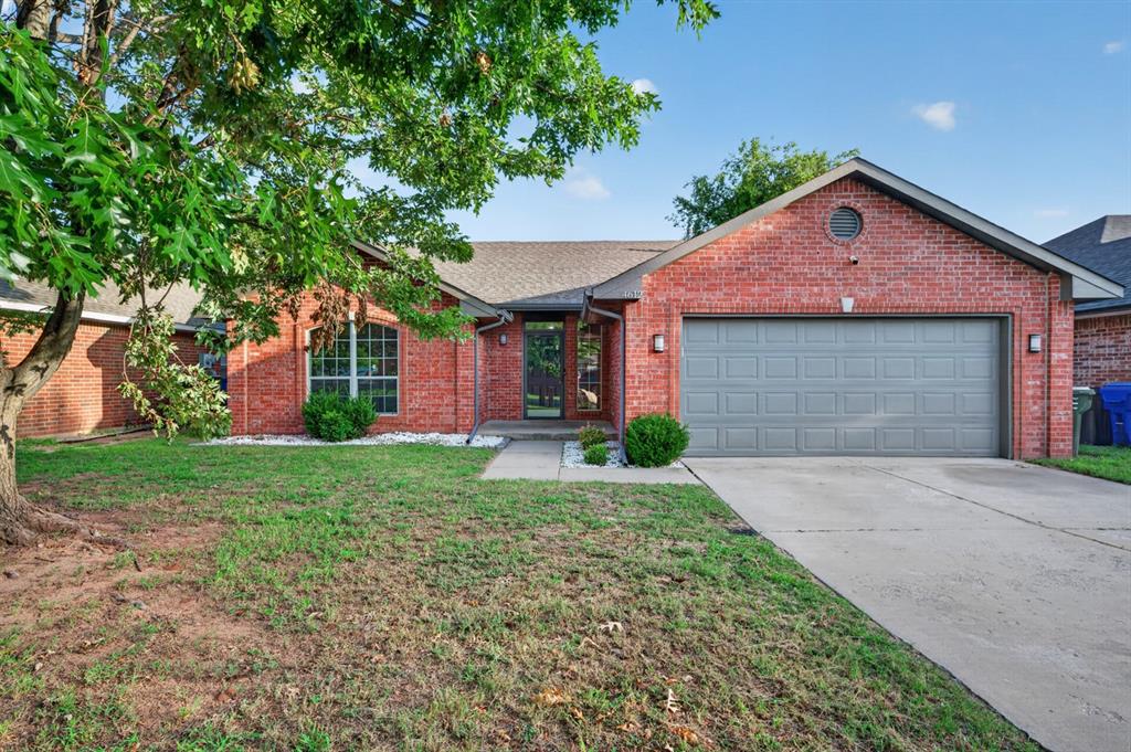 Welcome to this beautifully updated, move-in-ready home in a convenient west Norman location. The inviting brick exterior, mature shade trees, covered front entry, and 2021 roof create great curb appeal from the moment you arrive. Inside, the open floor plan features vaulted ceilings, neutral finishes, updated flooring, and a spacious living area centered around a gas fireplace. The remodeled kitchen offers quartz countertops, stainless steel appliances, updated cabinetry and hardware, open shelving, recessed lighting, and a large breakfast bar overlooking the living and dining areas. A separate study with built-in shelving provides the perfect space for a home office, playroom, or second living area. The primary suite includes two walk-in closets and an updated bathroom with dual vanities, a soaking tub, separate shower, and modern finishes. The guest bathroom has also been refreshed, and the generously sized utility room includes additional cabinets and a sink. Step outside to the screened-in covered patio and fully fenced backyard, ideal for relaxing or entertaining. Located near shopping, dining, Sooner Mall, and easy access to I-35, this home offers the updates, space, and location buyers are looking for. Refrigerator is negotiable.