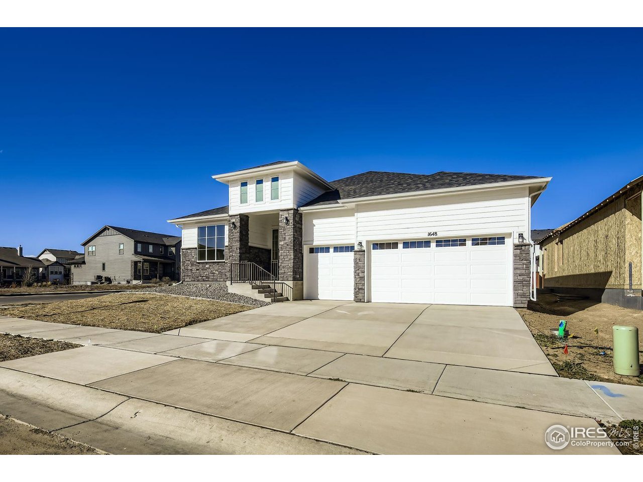 Welcome to this South facing spacious, single-story home on a 9052 sqft corner lot near the Raindance Golf Course entrance. This home offers 3 bedrooms, including a guest room with an ensuite bath, a study, 3 full baths and a main floor game room with 2,546 square feet of thoughtfully designed living space. The kitchen is a chef's dream, featuring Kitchen Aid appliances including built-in double convection ovens, 36" gas cook top, a large Quartz island, a walk-in pantry and a generous butler's pantry. There is plenty of counter space and ample storage with 42" upper cabinets in painted Linen and island cabinets in a warm stained Latte featuring soft close doors. It opens seamlessly to a large family room with 11' ceilings and a casual dining area, perfect for everyday living and entertaining. Additionally, a formal dining room provides a more elegant space for special occasions or turn this space into an optional game room featuring large barn doors. The main bedroom offers a private retreat with a bathroom that includes separate vanities, walk-in shower, a freestanding tub and a large walk-in closet for exceptional storage. A dedicated laundry room adds convenience and the 3-car garage offers ample space for both vehicles and extra storage. The unfinished basement with 9' walls provides endless possibilities for customization. The home invites outdoor enjoyment for everyone with a covered patio. Fully constructed closets with shoe racks ensure everything is neatly organized. Stay comfortable year-round with energy efficiency and with a tankless hot water heater. With its spacious layout and modern amenities, this home is designed to fit your lifestyle.