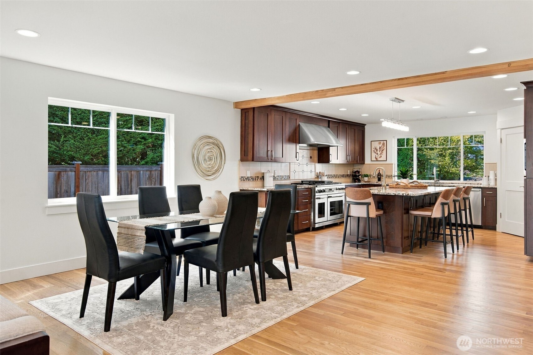 Dining sits just steps from the kitchen, ready for weeknight dinners and holiday hosting alike.