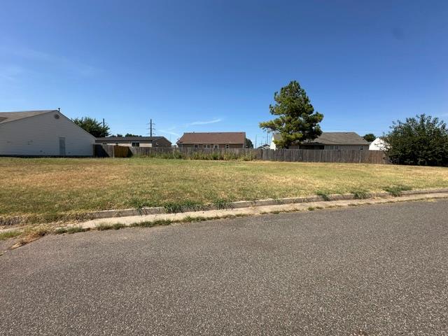 Open, flat lot in an established and well-cared-for neighborhood. Excellent Moore location centered near shopping, dining, schools, and daily amenities. Property offers **143 feet of frontage** with easy access to major routes, making commuting to **OKC or Norman** simple and convenient. A great opportunity for a new build in a desirable, mature area.