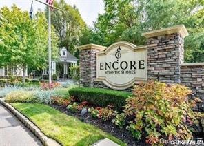 Welcome to 83 Ballad Court, located in the sought-after gated 55+ community of Encore Atlantic Shores in Eastport. This beautifully maintained development offers resort-style amenities including a clubhouse with both indoor and outdoor pools, pickleball and tennis courts, a fitness center, and a vibrant social atmosphere.

This stunning “Applause” model condo has been meticulously upgraded with every detail thoughtfully designed. The home opens with an elegant two-story foyer that sets the tone for the open and airy layout. The upgraded eat-in kitchen features premium cabinetry, a glass tile backsplash,  and brand new appliances including a stove and microwave. Flowing seamlessly into the formal dining and living room, you’ll find a gas fireplace with a custom mantle, rich moldings with chair rail and wainscoting, and a gorgeous custom stained-glass window that brings in natural light and artistry.

The first-floor primary suite is a true retreat, boasting a tiled ceiling, custom closets, and a beautifully appointed primary bath. A private library or office, a stylish half bath for guests, and a well-designed laundry room with custom cabinetry, farmhouse sink, new washer and dryer, and pantry complete the main level. Step outside to the screened-in porch and paver patio, where perennial gardens and private yard space create a serene outdoor oasis.

Upstairs, the home offers inviting guest quarters with new luxury vinyl flooring, a spacious bedroom, full bath, a large den, and a versatile bonus room that can be used as an exercise space, hobby room, or extra storage. Additional highlights include hardwood floors throughout the main level, 9' ceilings, custom window treatments with Hunter Douglas plantation shutters, central vacuum, whole-house circuit breaker, a humidifier, a brand-new HVAC system, and a two-car garage.

This exceptional residence combines elegant living with every modern convenience in a community designed for leisure and enjoyment. 83 Ballad Court is truly move-in ready and offers a lifestyle unlike any other on the South Shore.