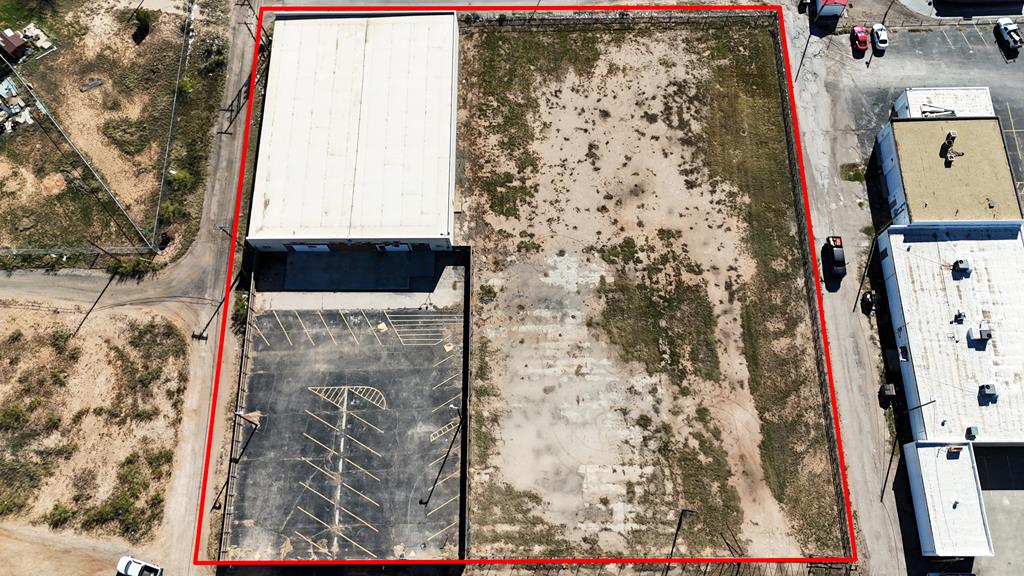 Warehouse offering an excellent opportunity for businesses seeking a versatile and spacious facility. Situated on a 1.76-acre fenced lot, this 13,755 square foot building features robust block construction, providing durability and security for a range of commercial uses. Zoned Heavy commercial and located near US HWY 385.