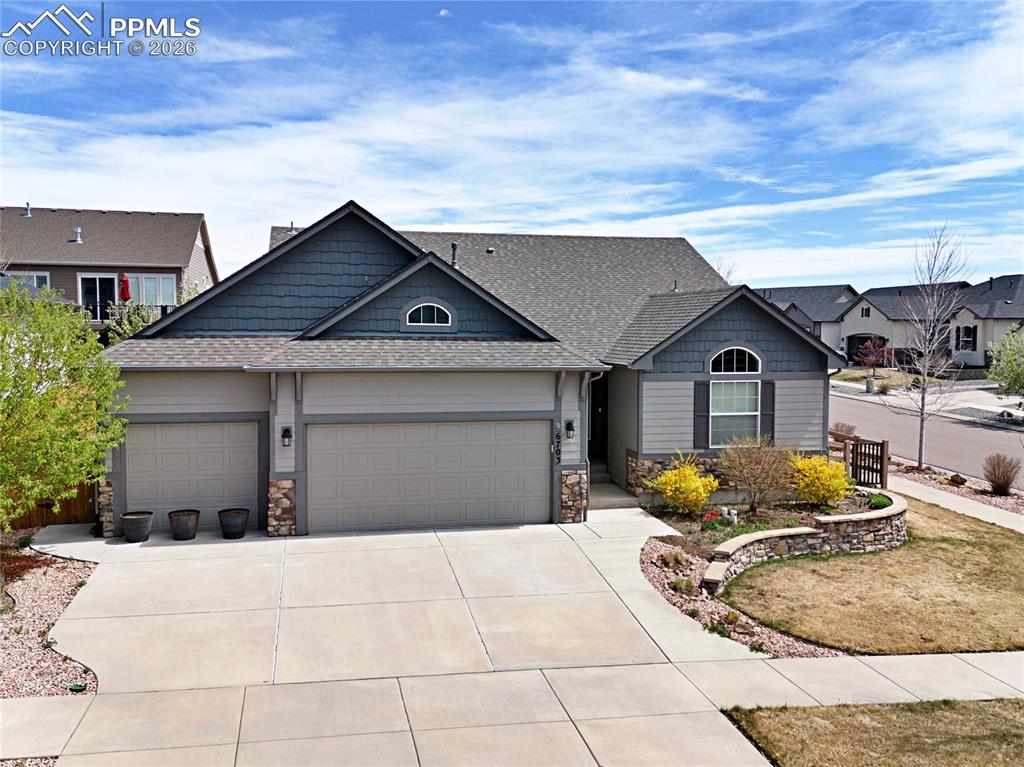 Beautiful, expansive ranch-style home in the highly sought-after Indigo Ranch community of Colorado Springs. Situated on a desirable corner lot, this five-bedroom, three-bath, three-car garage home offers 3,366 square feet of well-designed living space.The main level features an open floor plan with vaulted ceilings and abundant natural light. A spacious great room anchors the home, seamlessly connecting to an expansive kitchen with upgraded cabinetry, extended counter space, and a large island, perfect for entertaining or everyday living. Step outside to a generous concrete patio overlooking a fully fenced, landscaped yard with raised garden beds and a storage shed.The main floor also includes a private primary suite with an en suite bath and large walk-in closet, along with two additional bedrooms and an additional full bath.The finished lower level offers exceptional flexibility, with two additional bedrooms, a full bath, and a massive 22x15 family room complete with a wet bar and mini-refrigerator that's ideal for entertaining or guest space. An unfinished area is already roughed-in for an additional bathroom, presenting an excellent opportunity for a future junior suite or multigenerational living.The oversized three-car garage features coated floors and an ADA ramp, which can be easily removed to restore traditional stair access.Enjoy a beautifully maintained, park-like yard with terraced landscaping, full fencing, and thoughtful plantings, perfect for relaxing or entertaining outdoors.