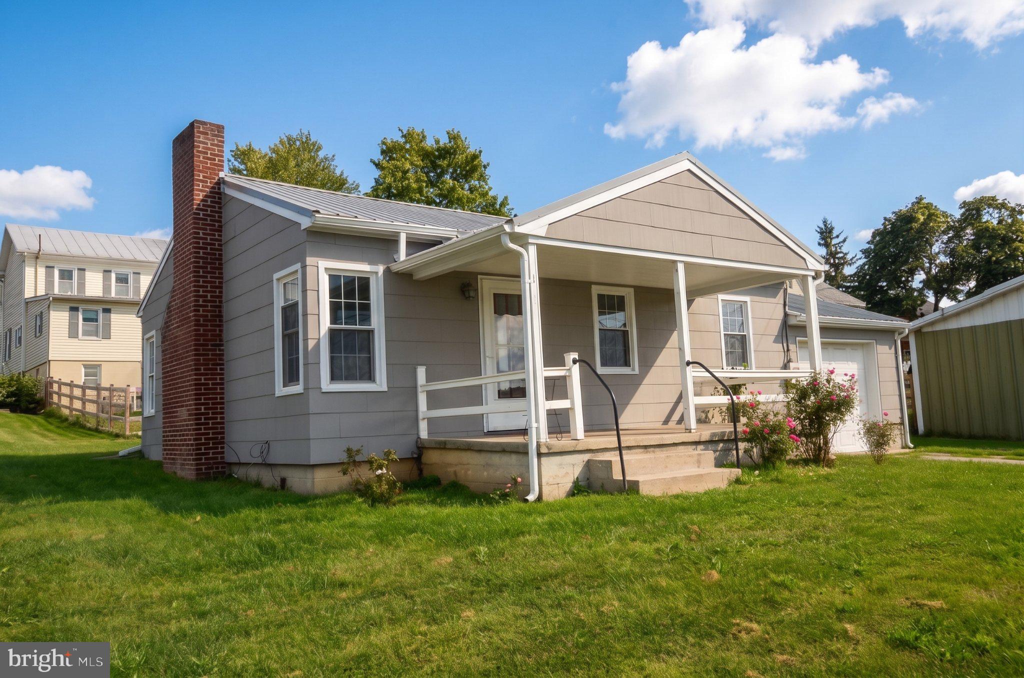 Discover the charm of this delightful bungalow nestled in the heart of Union Bridge. This home boasts a warm and inviting interior featuring beautiful hardwood and laminate plank flooring with a comfortable dining area and kitchenette.  The home has main level laundry and a convenient water filtration system in place.  Step outside to a well-maintained corner lot, complete with sidewalks and street lights, enhancing the neighborhood's appeal. The home also includes an inviting front porch and attached garage.  Located in a small downtown area, you'll enjoy easy access to all Union Bridge has to offer.  With a shed for extra storage, a manageable layout, this is a charming residence ideal for a first home or downsizing.  Home is ready for immediate purchase.