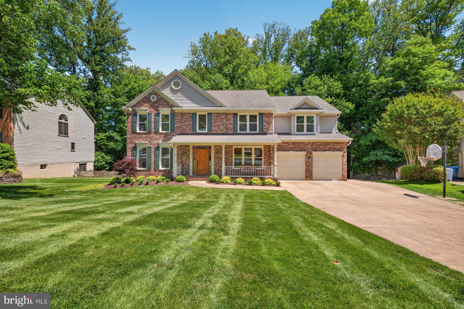 Welcome to 8704 Margaret Ln in the Woodland Forest community of Annandale. This 4-bedroom, 4-bath colonial offers over 4,400 square feet of living space across three levels, feeds into the highly regarded W.T. Woodson High School pyramid, and has a floor plan that flows well and outdoor spaces that are genuinely hard to find at any price point.Hardwood floors carry throughout the main level, starting in the grand two-story foyer. The kitchen has been updated with white shaker cabinets, granite counters, and a patterned tile backsplash. A gas cooktop, double wall ovens, and a peninsula with bar seating make it a great space for cooking and gathering. The breakfast area sits just off the kitchen with sliding glass doors leading out to the screened porch. The two-story family room centers around a floor-to-ceiling brick fireplace with gas logs and remote, arched windows, and access to the deck. A main level den with a full bath is perfect for a home office or guest space. The laundry room has been updated with white shaker cabinets, granite counters, a patterned tile backsplash, and an undermount sink.Upstairs, the primary suite spans nearly 500 square feet with a vaulted ceiling, recessed lighting, a separate sitting area, and wooded views. Two walk-in closets offer generous storage, and the en-suite bath includes a soaking tub, a separate glass-door shower, and a double vanity. Three additional bedrooms are well-sized, and the hall bath features a double vanity with updated counters and fixtures.The finished lower level offers a rec room with walkout access to the backyard through sliding glass doors. A full bath and a large unfinished utility and workshop area with an epoxy floor round out the lower level.The outdoor living package on this home is something buyers will not forget. The screened porch has a cedar tongue-and-groove cathedral ceiling with skylights, recessed lighting, a ceiling fan, and treetop views of the wooded backyard. From there, you step out to an open deck connected to an octagonal gazebo, with a hot tub that conveys with the home.Recent updates include kitchen counters and backsplash, fireplace mantel, a fully renovated laundry room, a new hot water heater installed in June 2023, and speckled epoxy flooring in the two-car garage. An existing home warranty is in place through February 2026.Zoned for Canterbury Woods Elementary, Frost Middle School, and W.T. Woodson High School. Please note that while this home carries an Annandale mailing address, it sits in the Woodson High School pyramid.Conveniently located with easy access to I-495, Braddock Road, and Route 236, making it a great option for commuters heading into Washington, D.C., Tysons, or the Pentagon corridor. Bus service on Braddock Road provides an easy ride to the Pentagon for those who prefer public transit. Everyday shopping and dining are close by, with grocery stores, restaurants, and retail along Braddock Rd and Little River Turnpike. The Springfield Town Center and Mosaic District at Merrifield are both just a short drive away. Make your appointment today!For questions and offer please contact Co-Listing Agent, Mena Nakhla, at 571-239-0117