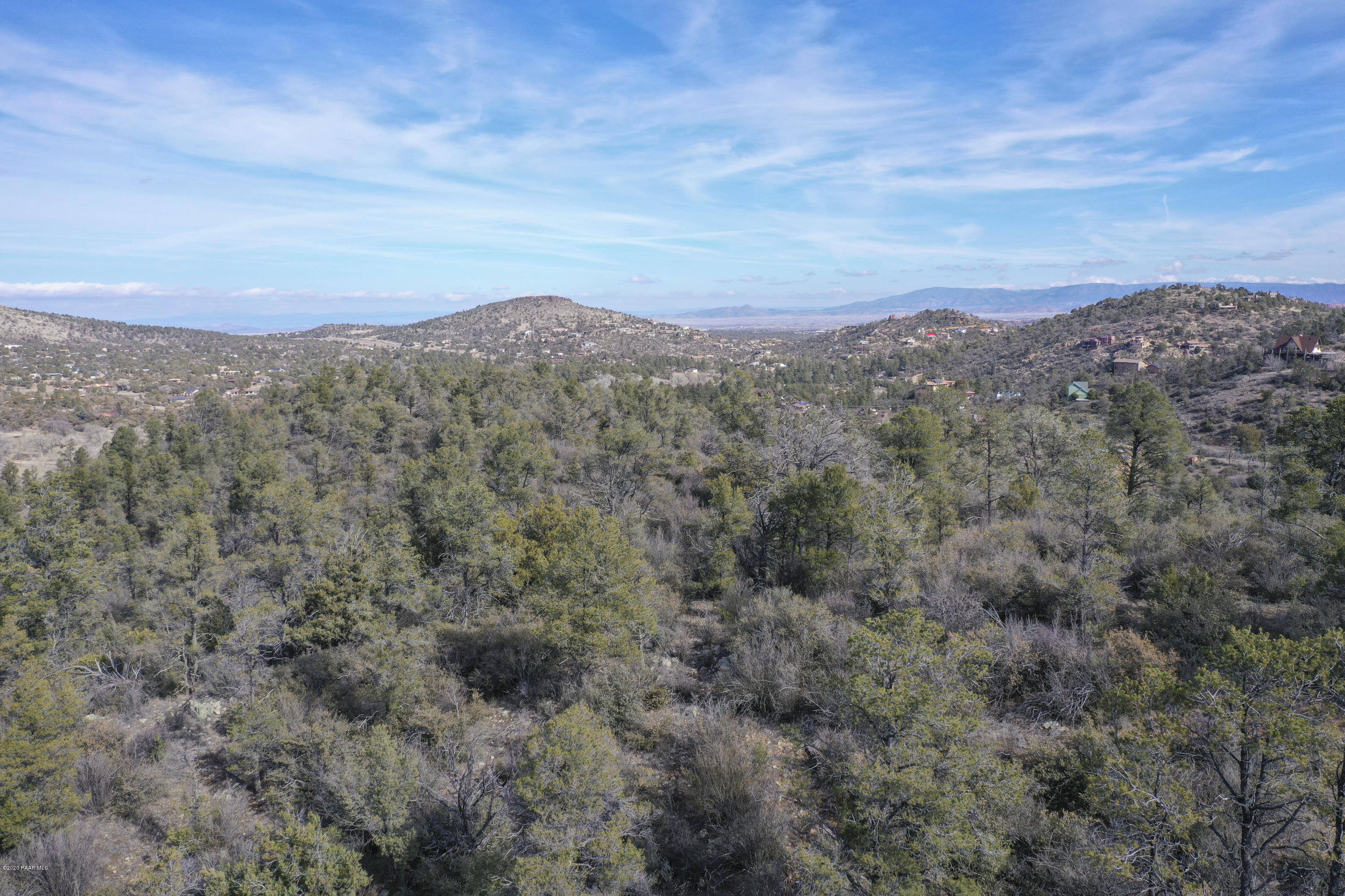 INCREDIBLE VIEWS! Perfect for a developer or someone who wants their own private mountain top. Approximately 47.37 Buildable acres of well treed land with amazing views of Granite Mountain, Thumb Butte and Williamson Valley and only 2 miles out Iron Springs Rd. This is a rare opportunity to find property that is so build-able, beautiful, all city utilities, and only 5 minutes to shopping, restaurants and medical! For Developers-we have GUARANTEED city water and sewer, and have a preliminary design concepts available along with other valuable info. Owner will consider a joint venture OR SHORT TERM OWNER CARRY!