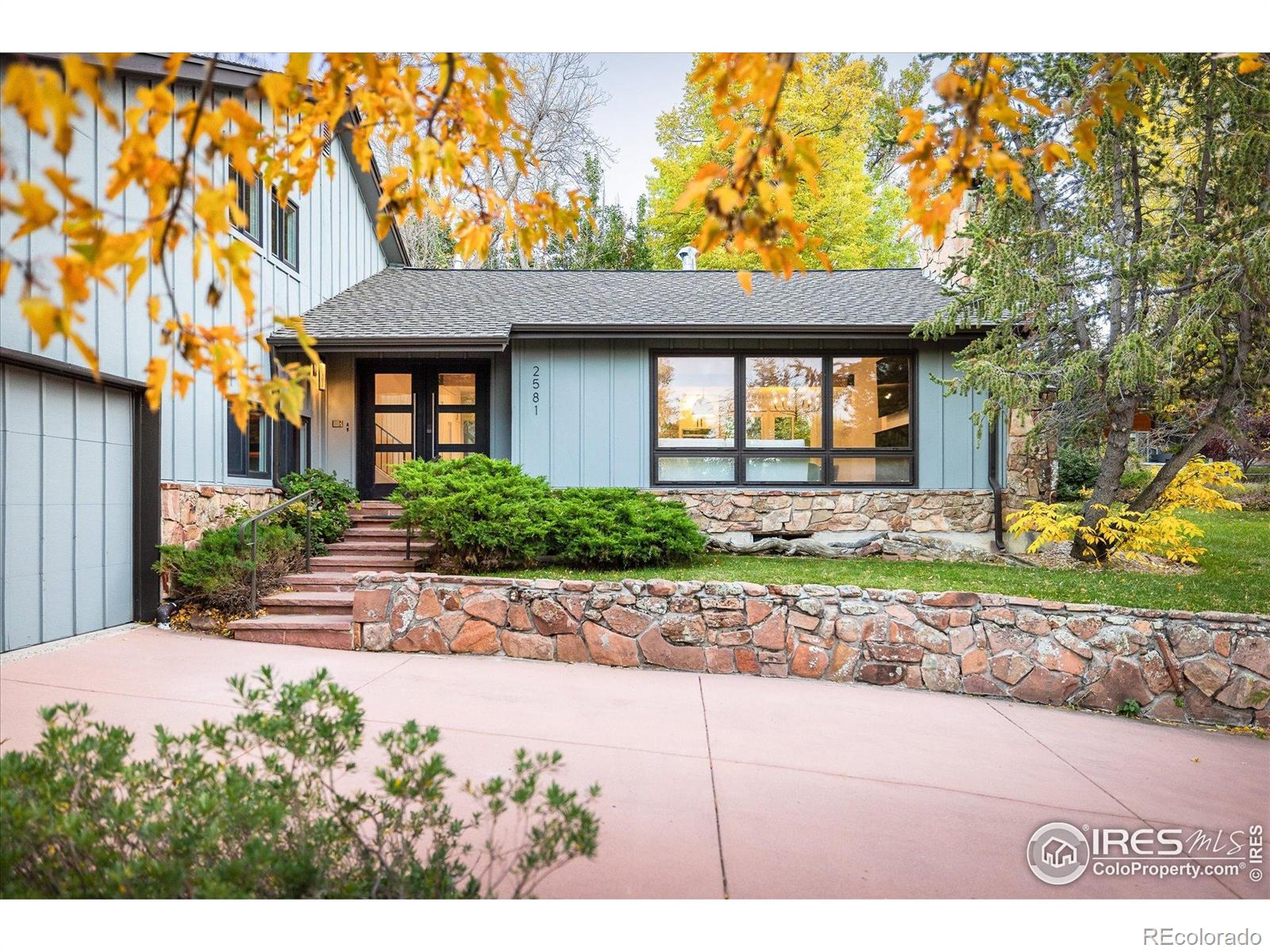 Experience the perfect blend of luxury, privacy, and natural beauty in this fully remodeled Devil's Thumb home. Perched on an oversized 0.37-acre cul-de-sac lot with park-like grounds, opulent windows frame breathtaking views of the Flatirons. Just steps from hiking trails and top-rated schools, this location offers a serene retreat while keeping Boulder's best amenities within easy reach. Inside, vaulted ceilings and abundant natural light highlight a thoughtful, flowing layout with roominess and seamless open-concept living, dining, and kitchen areas. A massive fireplace anchors the living space, creating a warm focal point for gatherings. The upper level features a light filled primary bedroom with ensuite bath, plus 2 additional bedrooms with a shared full bath, while the lower level offers a spacious family room, additional bedroom/study, full bath, large mudroom entry via garage, laundry room - plus ample storage in the unfinished basement and oversized garage. With over $850,000 in custom renovations, this home effortlessly blends modern luxury with timeless comfort.