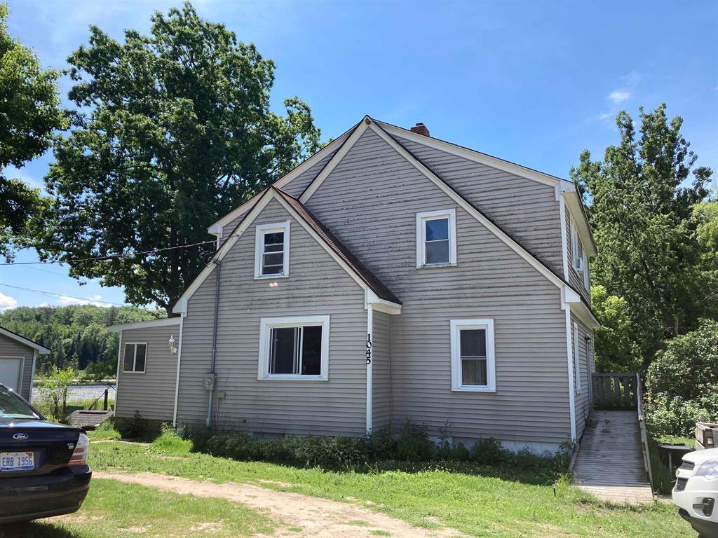 600+/- FEET ON ABBOTT LAKE and nearly instant access to trails and National Forest make this 3br, 2 bath home or recreational property the perfect place to hang your hat! Full unfinished basement, 1.5 car garage, large enclosed porch and an upstairs studio apartment with kitchen and full bath is perfect for family or company.