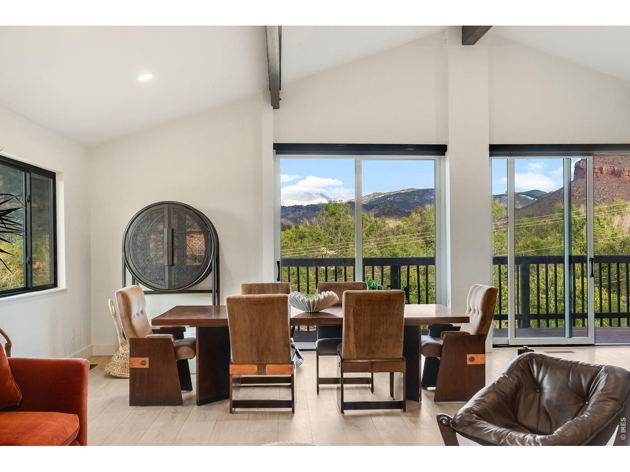 Warm and distinctly composed, 926 4th Avenue sits on the northern Colorado fretboard of the foothills, while close to downtown Lyons. After or before your showing, consider going to the town center and visit Marigold's to feel the quintessence of an evening at 926 4th Avenue (don't mind the neighborhood golf carts). Or perhaps a late morning trip to Planet Bluegrass may suit the mood just as well. With stirring views toward the mesas and a kismet look toward the summits of Longs and Meeker Peaks, the property carries an inspiring atmosphere. Step up onto the grassy balcony and continue on to the porch and through the sliding glass doors to see this fully reimagined space. Moving through the completely renovated kitchen and main floor you have an added primary suite, and a separate updated bed and bath. Downstairs, you have an additional suite, ideal for a visiting guest, an office or recreational space. Further down the hall, you have the fully affixed utility and laundry room. And across is the highly functional garage. All distinct, all considered, and fully renovated for your modern Lyons experience.