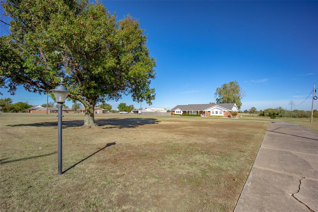 TIMELESS and PERFECTLY PRESERVED MID-CENTURY GEM on nearly 3 ACRES in the heart of OKC! Step inside to a CHARMING ENTRY with BLACK FLAGSTONE TILE and prepare to be wowed. You will not find a home from this era that has been BETTER CARED FOR! So many ORIGINAL FEATURES remain in PRISTINE CONDITION — PARQUET FLOORS, WOOD BEAMS, VINTAGE OVEN, BRICK-LOOK KITCHEN FLOORS, and RETRO TILE BATHS that take you back in time. The KITCHEN offers a BREAKFAST BAR, built-in CUTTING BOARD, and even a charming WRAP & FOIL STORAGE nook. Enjoy a HUGE LAUNDRY ROOM with BUILT-INS, a UTILITY SINK, and an EXTRA FULL BATHROOM WITH SHOWER conveniently located just off the garage. The 3-bedroom layout includes a FULL BASEMENT (approx. 755 SQ FT, not included in total footage) with a BAR AREA and PLUMBING FOR A BATHROOM—ideal as a FOURTH LIVING AREA, OFFICE, or GUEST SUITE. Two bedrooms feature PRIVATE BATHROOM SUITES, creating a MULTI-FAMILY FRIENDLY LAYOUT. Don’t miss the BRIGHT SUNROOM (approx. 567 SQ FT) that feels like a peaceful retreat. Outside, you’ll find a WONDERFUL BARN WITH ELECTRIC—perfect for hobbies, storage, or a workshop! REFRIGERATOR, WASHER AND DRYER STAY with an acceptable offer. CONVENIENT LOCATION with an EASY COMMUTE anywhere in the city. A MUST-SEE MID-CENTURY MASTERPIECE that offers CHARACTER, SPACE, and STYLE you won’t find anywhere else!