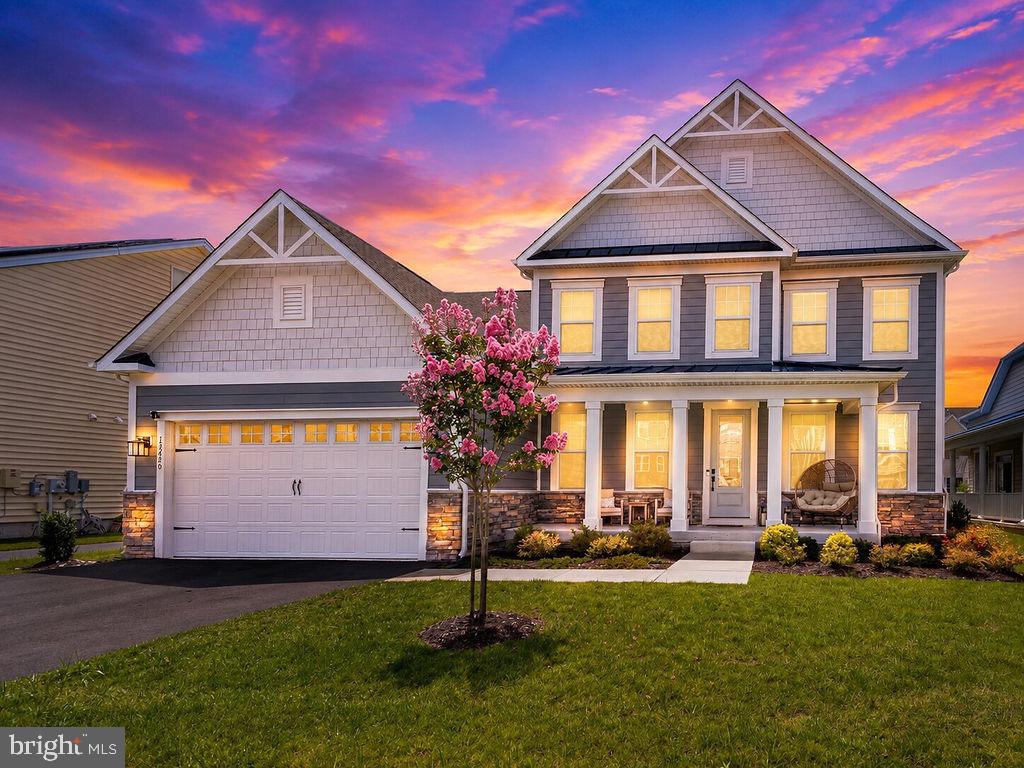 Coastal elegance meets modern comfort in this beautifully appointed, fully furnished home built in 2023, located in the highly sought-after Bayside community. Thoughtfully designed with a light and airy coastal vibe, every detail has been carefully selected, making this stunning home truly move-in ready.Offering 5 spacious bedrooms, 4 full bathrooms, and a dedicated home office, this home provides the perfect blend of luxury, comfort, and functionality. Upon entering, you’ll find a private home office just off the foyer, creating the ideal space for working remotely, studying, or enjoying a quiet retreat.The open concept floor plan is designed for effortless entertaining, with the spacious living room flowing seamlessly into the chef-inspired kitchen featuring quartz countertops, stainless steel appliances, a gas range, an oversized island, abundant cabinetry, and a generous dining area just off the kitchen that remains connected to the heart of the home perfect for everyday meals, holiday gatherings, and entertaining family and friends.The first-floor primary suite is a peaceful retreat featuring an elegant tray ceiling, a spacious walk-in closet, an additional closet providing extra storage or the convenience of a his-and-hers setup, and a beautifully appointed en suite bathroom. A second bedroom and full bathroom are also conveniently located on the main level, providing flexibility for guests or multigenerational living.Upstairs, you’ll find three additional bedrooms, two full bathrooms, and a spacious loft currently set up as a game room, offering endless possibilities as a second family room, media room, playroom, or recreation space.Additional highlights include a tankless water heater for energy efficiency and endless hot water, a blacktop driveway, and tasteful coastal finishes throughout.Enjoy your morning coffee on the inviting front porch or unwind on the covered rear porch the perfect place for outdoor dining, entertaining, or simply relaxing after a long day.Located within walking distance of Bayside’s exceptional amenities, residents enjoy a clubhouse, fitness center, indoor and outdoor pools, basketball and tennis courts, scenic ponds, a kayak launch with storage lockers, and a crabbing pier.Perfectly situated between Assateague Island and the beaches and Boardwalk of Ocean City, this exceptional home offers the ideal combination of resort-style amenities, coastal charm, and everyday convenience. Whether you’re searching for a year-round residence, a vacation getaway, or an investment opportunity, this turnkey Bayside home is one you won’t want to miss!
