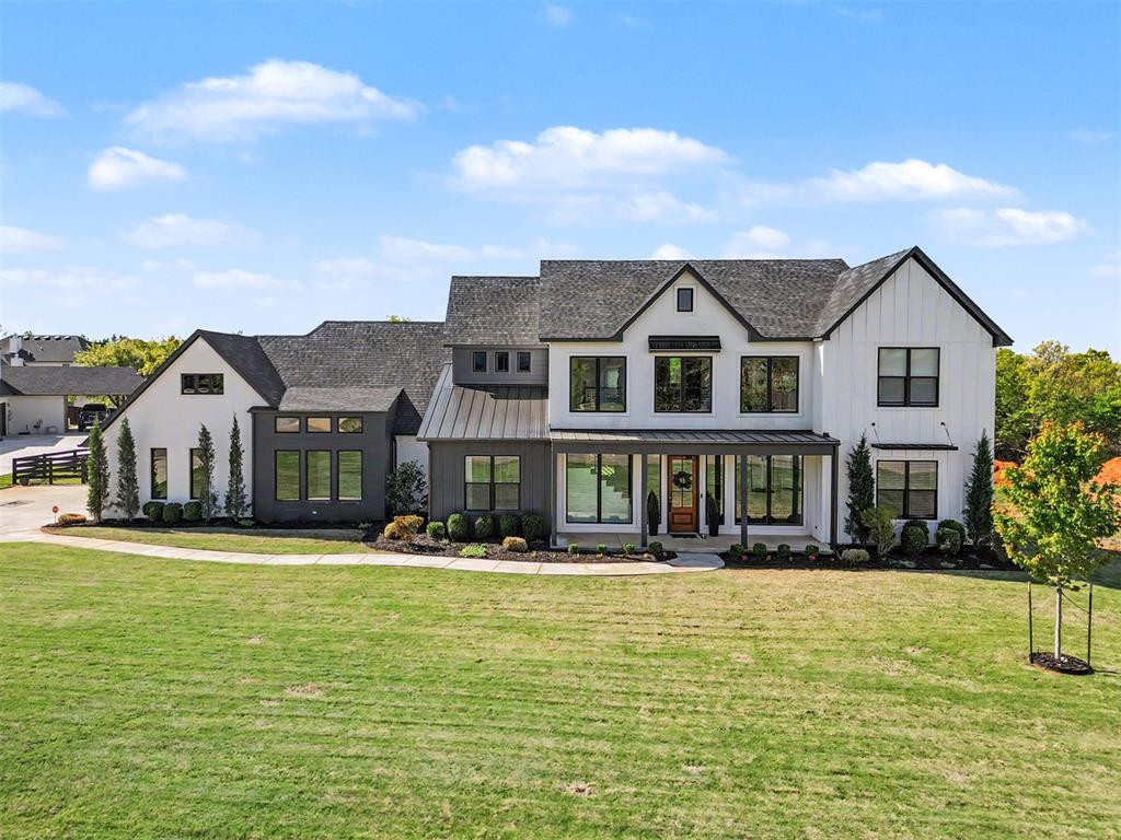 Welcome to this stunning two-story modern farmhouse tucked away on a quiet cul-de-sac in the gated neighborhood of Timberland Creek in North Edmond. Situated on a beautiful ¾-acre wooded lot, this home offers the perfect blend of luxury, comfort and modern beauty. Inside, you’ll find gorgeous wood floors, an open floor plan, and a chef’s kitchen designed for entertainment. The kitchen features a large island, spacious prep counter, Fisher & Paykel double ovens with griddle, and double drawer dishwasher, plus a butler’s pantry with glass pocket door where inside you’ll find a microwave, countertop, additional cabinets and drawer storage.The thoughtful floor plan includes a private primary suite and a guest bedroom downstairs, while upstairs offers two additional bedrooms and a versatile bonus room perfect for media, play area or exercise room. The office located on main floor which can also be the 5th bedroom. Step outside and enjoy the peaceful setting with a covered patio featuring a cozy fireplace, a fire pit area, and plenty of room to relax or entertain under the mature trees.Additional highlights include:• Oversized side-load garage with ZG Shield epoxy flooring and extra parking space, workbench and cabinet storage• Tankless water heater and water softener• Sprinkler system, security system, keyless entry This exceptional property offers modern farmhouse charm, premium finishes, and the space of a country setting just minutes from Edmond conveniences. Located just west of I-35, 13mins to downtown Edmond, 30mins to downtown OKC and 40mins to Will Rogers International Airport.
