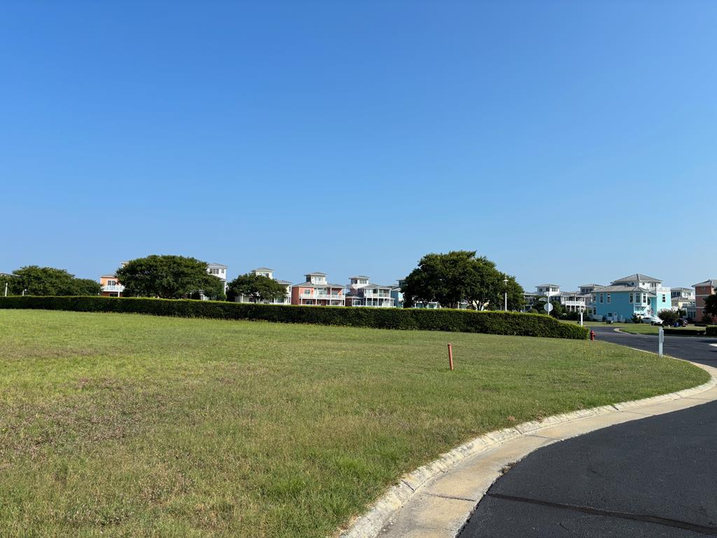 Perfect location, corner lot and blocks to private beach! In a quiet cul de sac, this level and spacious property is flanked with shrubs to the right for privacy and serenity. Get started today on your new home in the amazing golf cart community of Cape Charles! This is a rare NON-Membership required property!