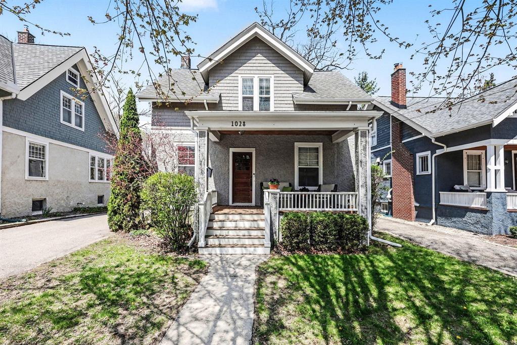 Expansive Old West Side home, remodeled in 2005, with almost 3,000 square feet of finished space! With loads of original charm and character, and hardwood floors throughout, the main floor features a large front ''sitting'' porch, first floor home office or den with French doors, formal living room, formal dining room with bay window, expansive and open kitchen with ample cabinet space, granite counters, stainless steel appliances, breakfast bar and pantry, a generous sized family room with wood burning fireplace, and built-in cabinets and shelving. Plus a powder room, first laundry room with utility sink, and covered side entrance. Upstairs offers a primary suite with walk-in closet with custom shelving, a huge primary bathroom with two sinks, a custom tiled walk-in shower, large soaking tub. Three additional bedrooms and second full bathroom. The basement has tons of storage space, and a great recreation room with bar and third full bathroom. Outside features a two-car detachedgarage, nice backyard with room to play, and backs to the woods and field at Slauson Middle School. This excellent location is just short walk to Eberwhite Elementary School, Slauson Middle School, and downtown Ann Arbor! Home Energy Score of 1. Download report at www.a2gov.org.
