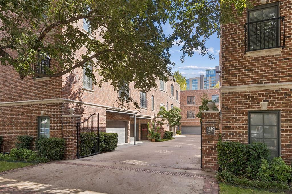 Opportunities like this rarely come along in the heart of Uptown Dallas! This exceptional corner unit in a gorgeous, intimate 10-home community offers something truly hard to find: an oversized private backyard, a rare luxury in urban living. Classic brick architecture, charming gas lanterns, and beautiful cast stone details create timeless curb appeal, while abundant windows fill the home with natural light. The thoughtfully designed floor plan offers both privacy and inviting spaces for entertaining. The first floor features a spacious bedroom with an ensuite bath and generous walk-in closet. Upstairs, the second floor is designed for gathering, with a beautifully appointed kitchen featuring stainless steel appliances and a built-in Sub-Zero refrigerator-freezer. A spacious dining area, wet bar, and expansive living room with a gas fireplace create a wonderful flow for everyday living and entertaining. The third floor is dedicated to a generous primary suite featuring an ensuite bath with dual sinks, a large soaking tub, separate shower, and spacious walk-in closet. Directly across from the primary suite is the impressive balcony, another standout feature of this special home. An easy-access two-car garage adds everyday convenience. Enjoy the best of Uptown living with the luxury of low-maintenance ownership and exceptional outdoor space. Just steps from the Katy Trail, convenient to Lakeside Park, and within walking distance of the shopping and dining along Knox-Henderson. Downtown Dallas, Trader Joe's, SMU, and major freeways are just a short drive away. Corner units with this combination of privacy, outdoor space, architectural charm, and location simply do not come available often!