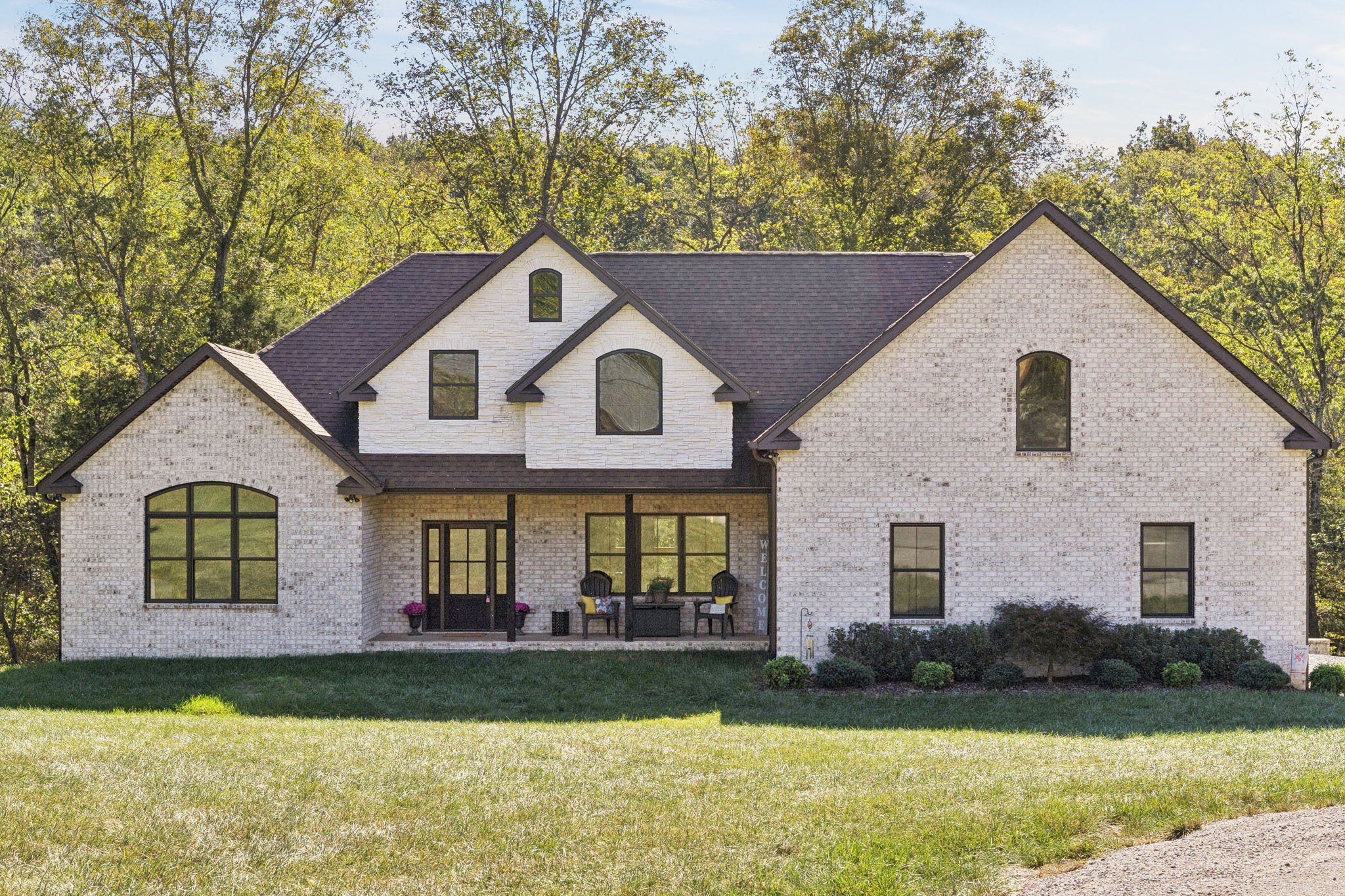 One of the newest homes in Town Pride Subdivision on one of the best lots that is bordered by the creek~one level of PURE HAPPINESS~this custom, one owner home feels like new the minute you walk in~beautiful brick on the exterior just gives a glimpse of the attractive interior that awaits! Real Hickory hardwood floors throughout~an open living/kitchen/dining concept with a large island topped with gorgeous quartz for plenty of cabinet and counter space~all stainless appliances and all remain~make the fireplace the center attraction just in time for the Christmas decorating to begin (or at least that is what IG is showing)~recessed lighting throughout~large master suite with a bath to die for and yes you can faint right on the heated tiled floors and never worry about getting chilled~tankless water heater and natural gas which is a rarity these days even in new construction~nice laundry room~walk-in attic great for storage~covered deck with a tongue and groove ceiling in rear where you can see the creek~pool table remains for all you pool sharks