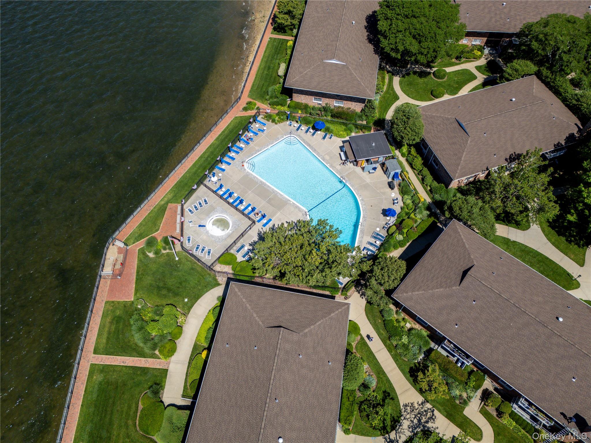 Nestled along the shores of Manhasset Bay in the desirable Manorhaven section of Port Washington, Toms Point Cooperative offers a unique waterfront lifestyle that feels more like a year-round resort than a traditional residential community. Residents enjoy an impressive collection of amenities including a waterfront swimming pool, private beach access, kayak storage, mooring rights, beautifully landscaped grounds, and a scenic bayfront promenade perfect for enjoying spectacular sunsets and water views.The gated community provides assigned parking, on-site management, storage facilities, bike rooms, and convenient laundry facilities, creating a comfortable and low-maintenance living experience. Toms Point's waterfront setting offers a rare opportunity to enjoy boating, kayaking, and coastal living while remaining just minutes from downtown Port Washington's vibrant shops, restaurants, and Long Island Rail Road station, providing a convenient commute to Manhattan.With its combination of waterfront recreation, resort-style amenities, and exceptional location, Toms Point has become one of Port Washington's most sought-after cooperative communities, offering residents the opportunity to enjoy the beauty of the North Shore in a peaceful and picturesque setting.This particular residence presents a rare opportunity for buyers seeking to create a home tailored to their own style and preferences. Requiring a complete renovation, the unit offers a blank canvas with the potential to design and customize every detail to your exact specifications. Whether your vision includes a modern waterfront retreat, a timeless coastal-inspired residence, or a sophisticated North Shore getaway, the combination of the unit's location, views, and community amenities provides an exceptional foundation for creating something truly special.