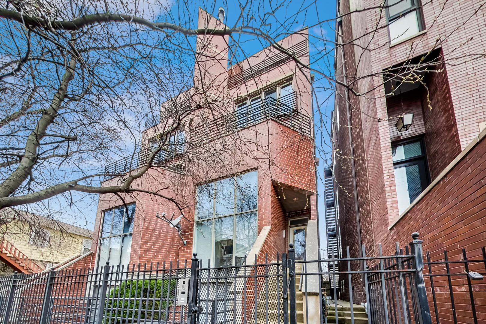 Open & Airy 3-Bedroom 2.5 bath in Red-Hot West Town / East Village!  Welcome to this south-facing, sun-drenched duplex that lives like a townhome! Featuring soaring ceilings, recently refinished hardwood floors, an updated kitchen, and two private outdoor spaces, this home checks all the boxes.    Enjoy the convenience of garage parking included in the price, all nestled on a quiet one-way street with zoned parking. With easy access to the Loop, expressways, and public transportation, the location is unbeatable.    Whether you're entertaining or just relaxing at home, this space offers comfort, light, and style. Welcome home!