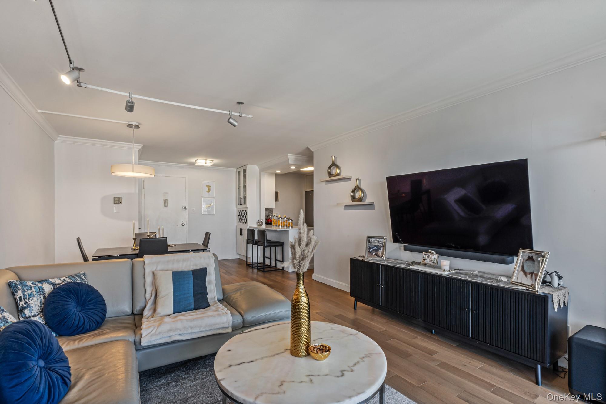 Discover luxury living with breathtaking views in one of Bayside, New York’s most sought-after developments. If you have been searching for the perfect home with a spacious layout, elegant updates, and spectacular scenery, your search ends here. This stunning 2-bedroom, 2-bath residence is move-in ready and designed to create a tranquil, sophisticated atmosphere. Features include gorgeous hardwood floors, a lovely, updated kitchen with high-end stainless-steel appliances, custom motorized blinds, and an oversized balcony perfect for relaxing in the sun, dining al fresco, or unwinding after a long day while enjoying panoramic views of the Manhattan skyline, the Long Island Sound, and Little Neck Bay. This full-service development offers exceptional amenities, including a 24-hour doorman, security, indoor parking, resort-style pool, fitness center, tennis and pickleball courts, playground, and more. Ideally located near transportation, schools, houses of worship, shopping, dining, parks, and more, this home truly has it all. Truly, a must-see! Maintenance includes all taxes, gas, electric, and cable!