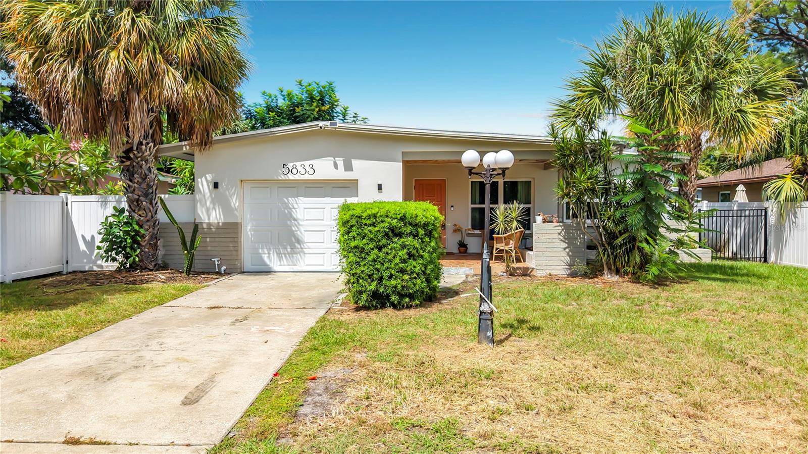 Welcome home to easy Florida living in the heart of St. Petersburg! This beautifully updated 3-bedroom, 2-bath block home with a 1-car garage blends modern style, functionality, and peace-of-mind upgrades. Enjoy year-round comfort with a brand-new HVAC system (2024), energy-efficient impact windows, two recently installed impact-rated exterior doors, and a 2020 roof already in place. Step inside to a bright, open-concept layout filled with natural light and thoughtfully selected finishes throughout. The living area flows seamlessly into the beautifully updated kitchen featuring quartz countertops, sleek modern cabinetry, and stainless steel appliances—perfect for everyday living and entertaining. The spacious primary suite offers a private escape with its own en-suite bath, complete with dual shower heads, while two additional bedrooms provide plenty of flexibility for guests, a home office, or whatever best fits your lifestyle. Outside, the fully fenced backyard offers both privacy and plenty of room to enjoy the Florida lifestyle. Create your ideal outdoor space with a garden, firepit, entertaining area, or simply a relaxing place to enjoy the sunshine. Conveniently located just minutes from shopping, dining, vibrant downtown St. Pete, and the beautiful Gulf beaches, this move-in-ready home offers the updates, location, and lifestyle you've been looking for. Don’t miss your opportunity to make it yours!