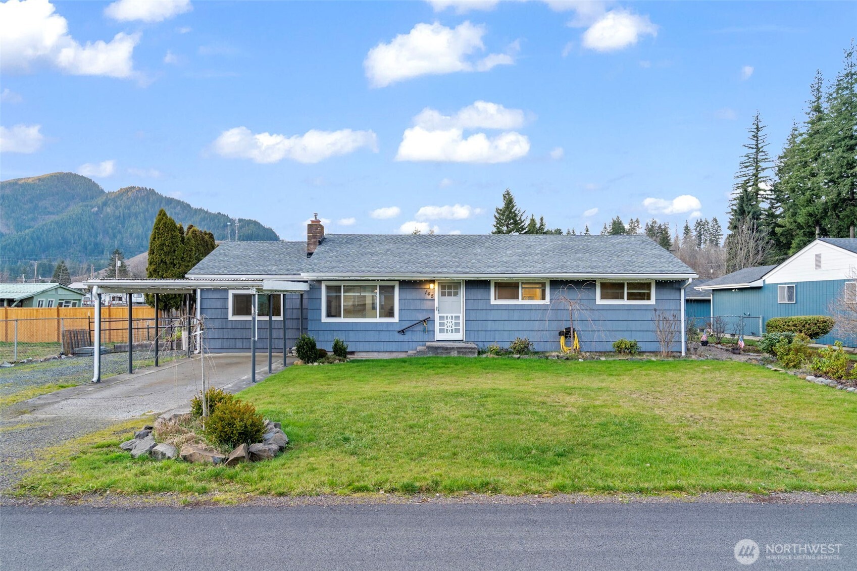 Bright, open, and beautifully remodeled rambler ideally located within walking distance to the city center, Jubilee Park, and the Middle/High School. This thoughtfully updated home features three bedrooms plus a den and spacious family room. The fully remodeled 2021 interior showcases stainless steel appliances, upgraded cabinetry, granite countertops, vinyl windows, cedar siding, updated roof, plumbing, electrical, and interior doors—truly a complete top-to-bottom renovation Durable vinyl plank flooring runs throughout, with comfortable carpeting in the bedrooms. Enjoy the generous family room with a stunning oversized picture window that fills the space with natural light. Outdoors, you'll find a gardener’s paradise with beautifully maintained front and back gardens, a dedicated garden area, shop, RV parking, and convenient alley access to the backyard. A must-see property offering both charm and functionality!