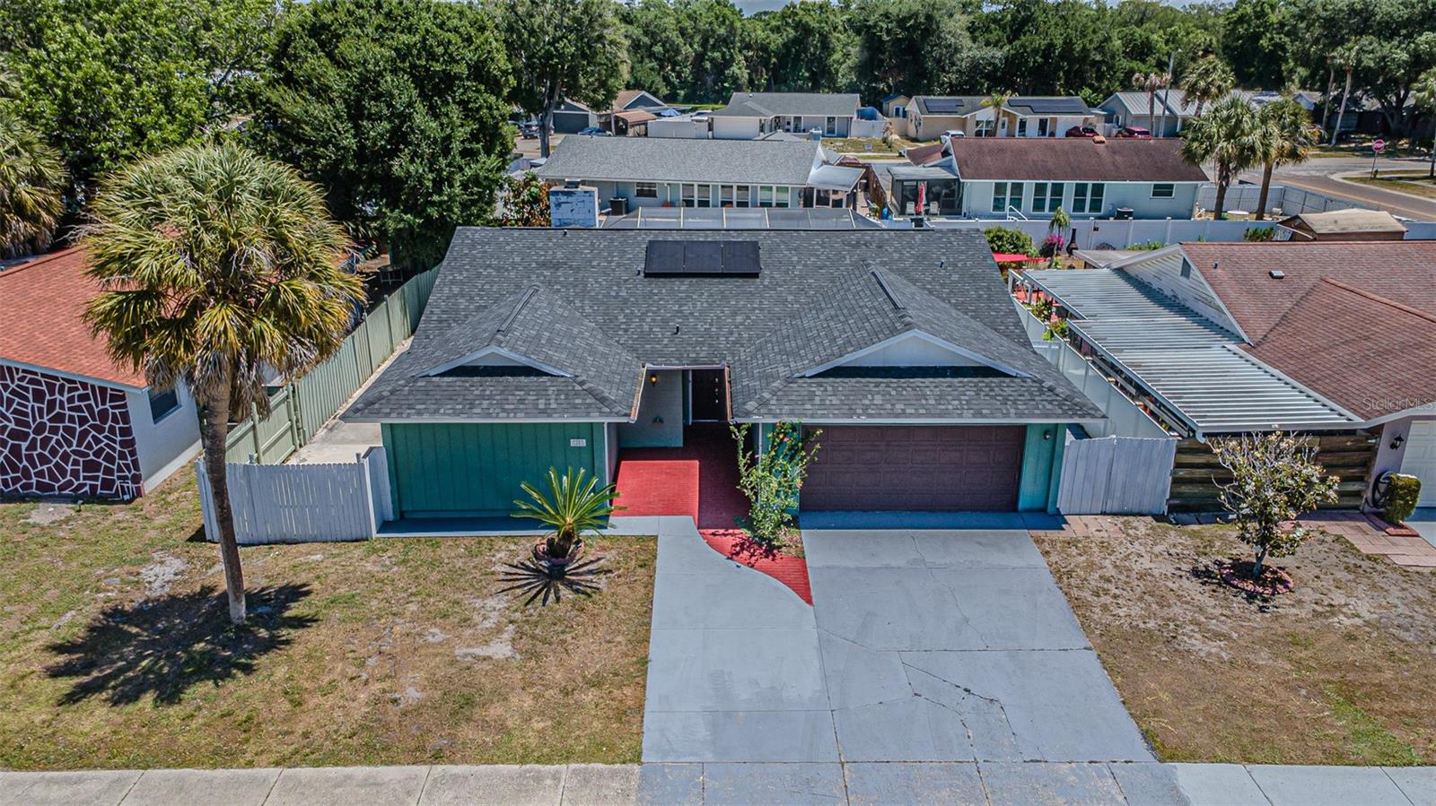 Spectacular Property with Income Potential in Town ‘n’ Country – Prime Location!Discover this incredible opportunity in the heart of Town ‘n’ Country, one of Tampa’s most convenient and desirable areas. This 4-bedroom, 3.5-bathroom home offers the perfect blend of comfort, functionality, and investment potential.Enjoy a beautiful private pool, ideal for entertaining and year-round family enjoyment. The property features fully paid-off solar panels, providing significant energy savings—practically eliminating your electricity bill.As an exceptional added value, the garage has been converted into an independent apartment, generating additional income from day one—perfect for rental, guests, or multi-generational living.Ideally located near top-rated restaurants, Tampa International Airport, major highways, and just minutes from the renowned beaches of the Tampa Bay area, this home offers location, income potential, and lifestyle all in one.Don’t miss this rare opportunity—schedule your private showing today and start enjoying everything this property has to offer!