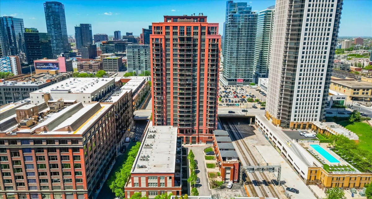 Spacious 3-Bedroom Duplex-Up with Private Terrace in the Heart of Fulton River District - Parking Included!  Welcome to this incredibly unique and spacious 2-level, 2,000 sq ft duplex-up located in the vibrant Fulton River District. This well-appointed 3-bedroom, 2.5-bath home lives like a single-family while offering the convenience of full-service condo amenities-all on the same level.  The main floor features refinished dark walnut hardwood floors, 10-foot ceilings, and a spacious living room with a cozy fireplace. The eat-in kitchen is perfect for cooking and entertaining, outfitted with cherry cabinetry, granite countertops, upgraded stainless steel appliances, and a double oven. Step outside to your private 240 sq ft terrace, complete with low-maintenance composite decking-ideal for outdoor dining and relaxing.  Upstairs, the expansive primary suite features new Berber carpet, a double vanity, soaking tub, and separate shower. A second bedroom also offers new carpet, and the third bedroom includes hardwood flooring with a closet to be installed by the seller. An in-unit washer/dryer and tons of storage complete this thoughtfully designed home.  Building amenities include 24-hour door staff, on-site property manager (Mon-Fri), fitness center, party room, bike room, dry cleaner, and more. Deeded parking for an additional $30k. Unbeatable location-steps to the CTA Blue & Green Lines, Metra, French Market, East Bank Club, Riverwalk, Jewel, Starbucks, and the area's best dining, shopping, and nightlife.  Don't miss this rare opportunity to own a one-of-a-kind home in one of Chicago's most connected and exciting neighborhoods!
