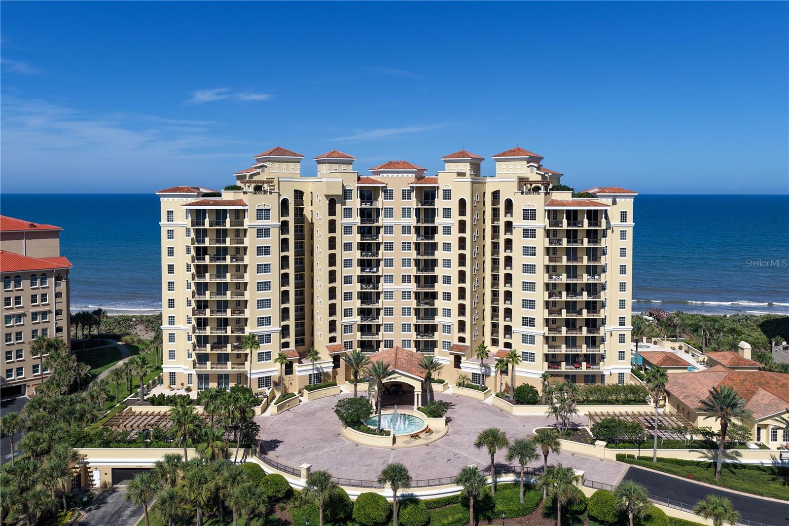 There is something different about living directly on the ocean. The light, the sound of the waves, the changing horizon and at Cambria at Hammock Dunes, it begins the moment your private elevator opens directly into Residence 405. Unobstructed Atlantic Ocean views immediately become the backdrop to everyday living, while 24 inch polished porcelain floors reflect the natural light and give this residence a wonderful sense of openness and scale. The thoughtfully designed floor plan also offers the flexibility to create a third bedroom, allowing the residence to adapt to your individual needs and lifestyle. This is oceanfront living that feels both refined and remarkably comfortable. Thoughtfully updated and beautifully maintained, the residence underwent an extensive refresh in December 2025. The bathrooms were transformed with porcelain tile floors, showers and surrounds, Brizo plumbing valves and fixtures, and striking black leathered quartzite vanity tops. The entire condominium was also freshly repainted at that time. The kitchen features modern appliances, while a dedicated laundry room offers a full size washer and dryer.Additional improvements include a newer Trane HVAC system, water heater and dehumidification system.And then there is Cambria itself.One of the building's most distinctive features is its two recently refreshed private guest suites, available exclusively for residents, giving visiting family and friends their own comfortable accommodations without sacrificing the privacy of your home. Residents also enjoy an oceanfront pool and spa, fitness center, theater room, social room with caterer's kitchen, climate controlled wine storage, sauna and steam rooms, outdoor grilling areas and direct beach access.Ownership includes two assigned garage parking spaces.Perfectly positioned within the highly sought after oceanfront community of Hammock Dunes in Palm Coast, Florida, Residence 405 offers more than a beautiful condominium by the sea. Here, the Atlantic Ocean is part of your everyday life, with miles of pristine coastline just outside your door and the privacy, natural beauty and relaxed coastal lifestyle that make Hammock Dunes so special.For those who desire the complete private club experience, Hammock Dunes Club membership is available separately and is not required with condominium ownership. Membership provides access to the Club's golf, dining, fitness, tennis, pickleball and additional private club amenities.Private elevator plus service elevators. Direct Atlantic Ocean views. Exceptional resident amenities. The privacy of Hammock Dunes. This is a place designed not simply for where you live, but for how you live.