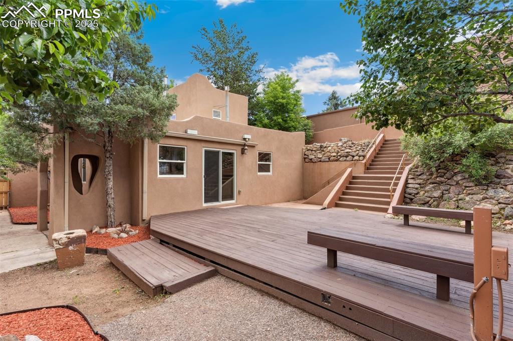 Welcome home to a true masterpiece where timeless character meets modern vision. This property says it all! Nestled in one of the most desirable pockets near Manitou Springs, this property offers an extraordinary blend of history, charm, and updated living rarely available in today’s market. Step back nearly 100 years into this beautifully preserved, well-cared-for timepiece, where every detail reflects craftsmanship and pride of ownership. Stunning hardwood floors stretch throughout, while magnificent log-beamed ceilings soar overhead, creating rustic elegance that embraces Colorado’s mountain lifestyle. The kitchen has been thoughtfully and completely remodeled, seamlessly blending old-world charm with modern convenience—featuring granite countertops, custom cabinetry, and stainless-steel appliances that make both everyday living and entertaining a delight. Step out from the breakfast niche onto an expansive outdoor deck designed for gatherings and relaxation. Picture cool Colorado evenings around your fire pit, or long summer nights with family and friends, where there’s plenty of space for outdoor dining, a hot tub, or simply soaking in the peaceful setting. This one-of-a-kind property offers exceptional flexibility with its multi-level design, featuring bedrooms with adjoining baths and separate access points—perfect for extended family, guests, or as a highly desirable income property. Whether you're envisioning a private residence, vacation rental, or multi-generational haven, the possibilities are endless. And when it comes to location, few properties can compete super-fast access to Highway 24,minutes to I-25, and literally steps from the heart of Manitou Springs where boutique shops, galleries, fine dining, and vibrant local culture await. It's not just a home—it’s a lifestyle. For buyers with discerning taste, investors with vision, or anyone seeking a residence that embodies both history and modern comfort—this is truly a MUST SEE PROPERTY.