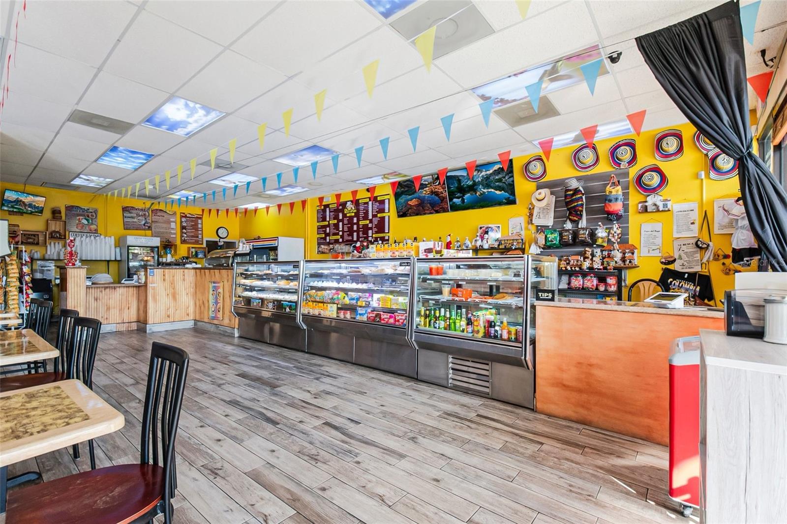 Turnkey Colombian bakery and restaurant for sale in a high-traffic commercial plaza along E Semoran Blvd in Apopka, FL. This established business includes all equipment, furniture, inventory, recipes, brand assets, and a rare transferable 4COP full liquor license, offering immediate potential to expand into a full-service restaurant or bar. The space features a fully equipped commercial kitchen, bakery ovens, display cases, POS system, dine-in seating, and ample shared parking within the plaza. Strong customer base with excellent online reviews, steady revenue, and partnerships with major delivery platforms. Assignable lease with favorable terms makes this a seamless ownership transition for restaurateurs, investors, or families looking for a profitable operation in a rapidly growing area.