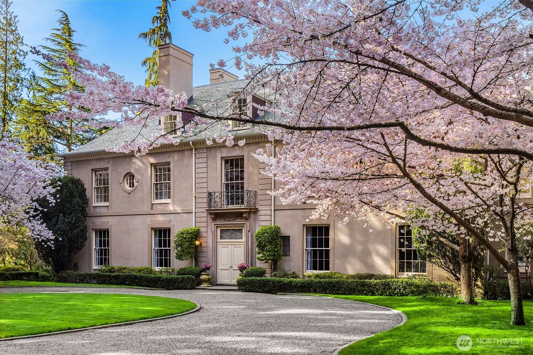 A rare Georgian estate by Charles A. Platt, set on 7.26 bluffside acres in the gated Highlands community. Hand-painted frescos, a sun-wrapped kitchen, and a library with soaring ceilings offer timeless elegance. Designed by Frederick Olmstead, the grounds invite serene walks to a pond, woodland paths, and sweeping Puget Sound views. Host grand gatherings or savor quiet moments in the loggia. With 8 beds, 8.25 baths, and a 4-car garage, this home blends historic grandeur with intimate beauty—like a French countryside escape just minutes from Seattle.