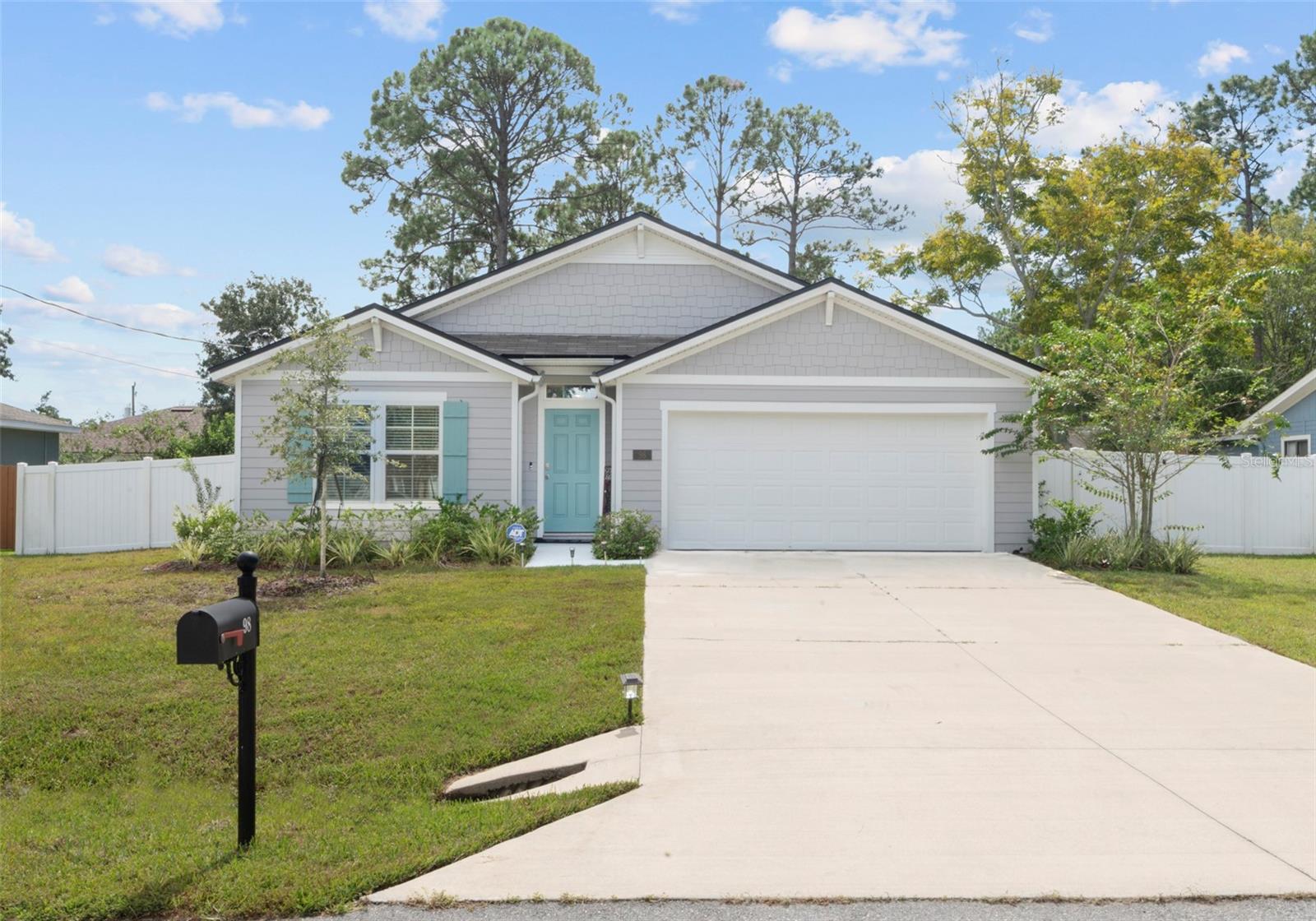 Welcome to this beautifully enhanced 2023-built home in Palm Coast’s Lehigh Woods neighborhood! Featuring the Cali floor plan by D.R. Horton, this four-bedroom, two-bath home offers an open layout with a spacious kitchen, elegant cabinetry, a walk-in pantry, and stainless-steel appliances. The owner’s suite includes a large walk-in closet and a walk-in shower. The current owners have invested time, love, and care into creating a model-home feel. Fresh interior paint and a stylish board-and-batten accent wall in the entryway add elegance and character, while an upgraded farmhouse-style kitchen sink and new cabinet hardware complementing the stainless-steel appliances provide stylish finishing touches. All kitchen appliances, along with the washer and dryer, are included. Outside, an added gazebo creates an inviting space to relax or entertain. Fencing on both sides and a wooded, currently undeveloped lot behind the home provide a peaceful backdrop and a welcome sense of privacy. Conveniently located near parks, schools, shopping, and dining, and approximately 15 minutes from Flagler Beach, this move-in-ready home offers comfort and convenience. An additional financial advantage for qualified buyers is the opportunity to assume the existing mortgage at a 4.99 interest rate, subject to lender approval and loan terms. Contact me today for more details and to schedule your private showing!