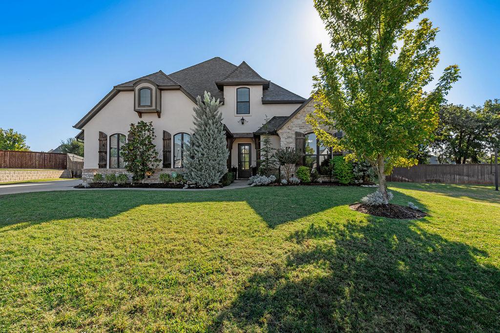Modern French Country Elegance with Exceptional Indoor & Outdoor Living!Nestled on a beautifully landscaped cul-de-sac lot, this stunning 5-bedroom, 4-bath residence combines timeless European-inspired architecture with sophisticated modern finishes. Steeply pitched rooflines, natural stone, creamy stucco, rustic timber accents, and charming arched windows create captivating curb appeal.Inside, soaring ceilings, rich wood floors, exposed beams, and abundant natural light complement the home's spacious, thoughtfully designed interior. Two generous living areas offer flexibility for entertaining and everyday living, while a striking fireplace creates a beautiful focal point.The impressive kitchen features quartz countertops, stainless steel built-in double ovens and microwave, gas cooktop, elegant glass-front display cabinetry, a spacious pantry, and an expansive breakfast bar perfect for gathering.The luxurious primary suite offers a private retreat with a spa-inspired bath featuring a freestanding soaking tub, oversized walk-in shower, custom double vanities, and a built-in illuminated makeup vanity. Multiple flexible spaces provide excellent options for home offices, hobbies, or workspaces. An upstairs bedroom suite with its own living area offers wonderful privacy for guests or extended family.Outdoor living is equally impressive! Relax or entertain on the spacious covered patio featuring an outdoor fireplace and fully equipped built-in cooking area. Professionally landscaped grounds and a backyard lined with towering pines create a beautiful backdrop for outdoor enjoyment.A three-car side-entry garage completes this exceptional property.A remarkable blend of architectural character, modern luxury, and versatile living spaces in a desirable Edmond cul-de-sac setting!