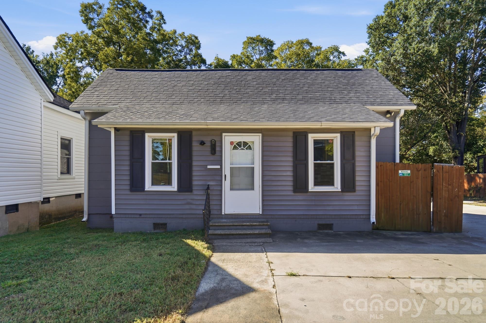 Two adjoining parcels totaling approximately 0.37 acre, sold together near downtown Rock Hill. This single-story house offers three bedrooms and a spacious yard with room for gardening, outdoor games and gatherings with family and friends. Features include vinyl siding, a concrete driveway, city water and sewer, and no HOA. Refrigerator, stove and dishwasher convey. Convenient to Old Town dining, shopping and community events. Sale includes 934 and 938 E White Street.