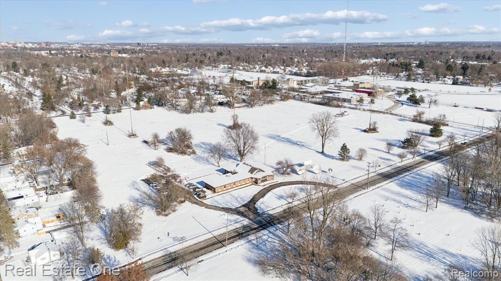 Unlock the potential of this expansive 14-acre parcel offering prime commercial, multi-use development opportunities.  Located on dual access points on West Mason  and West Cavanaugh, the property provides flexibility and convenience for a variety of uses.  Preliminary lot split drawings are available, showing removal of the existing building and radio tower which are not included in the property.  The owner is open to splitting the lots upon accepted offer-bring your vision and make it a reality.