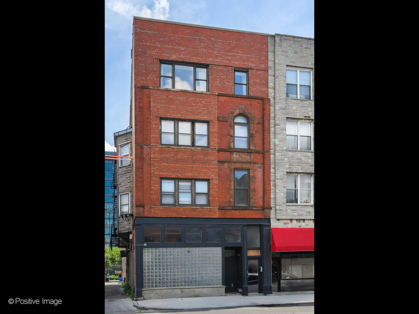 Exceptional opportunity to lease a stunning light-filled top-floor penthouse in a 5-unit boutique vintage brick building where River West meets Fulton Market on Grand Avenue. This 2-bed, 2 bath residence offers nearly 1800 sq ft of beautifully finished living space with amazing views of the City all along the east side of the home, including from the library which is just steps off of your private ELEVATOR.  The 9 ft ceilings, open concept kitchen, (with black granite and custom cabinets), in-unit laundry, attached 1-car garage space and shared 600 sq ft terrace with gas grill provided off the 2nd floor elevator stop make this a true urban sanctuary. Butterfly intercom system allows for safe package delivery, easy access for guests. Steps to transit, fabulous restaurants, and all that Fulton Market has to offer. Building is co-owned by listing Broker.  Available August 1.