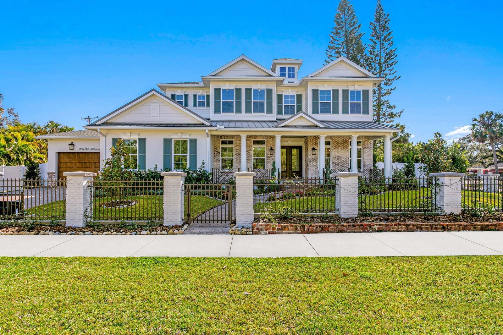 A gated entry framed by a black iron fence, brick columns, stone wall, and curated exterior lighting introduces this exceptional new construction by New Legacy Homes, establishing a sense of privacy, timeless elegance, and refined architectural presence. Situated in the desirable Beach Park / Swann Estates neighborhood, the residence reflects a thoughtful balance of luxury, functionality, and intentional design. A dramatic two-story foyer welcomes you inside, flanked by a formal dining room featuring a custom wine display and an elegant study. The great room commands attention with a sophisticated fireplace and an accordion-style NanaWall glass system that opens effortlessly to the outdoor living areas, creating a seamless indoor-outdoor experience. Designed for both luxurious daily living and grand entertaining, the gourmet chef’s kitchen features Sub-Zero and Wolf appliances, an oversized island with seating and storage, custom cabinetry, pot filler, breakfast area, expansive walk-in pantry, and a fully equipped prep kitchen. The main living spaces overlook the pool and spa, outdoor kitchen, covered lanai, and private backyard, further enhancing the home’s connection to its surroundings. The first floor offers a thoughtfully designed split-bedroom layout, providing coveted privacy with a guest suite and a grand owner’s retreat. The primary suite serves as a serene escape, highlighted by tray ceilings, a spa-inspired bath with soaking tub and standalone shower, and a custom walk-in closet. Upstairs, three additional bedrooms each feature ensuite baths and walk-in closets, accompanied by a spacious bonus and game room with wet bar and a dedicated media room designed for memorable movie nights. Outdoor living is elevated by a resort-style pool cabana complete with lounge area, entertaining wet bar, kitchenette with breakfast bar, full bath with shower, and stackable washer and dryer hookups. The Energy Star Certified residence incorporates energy-efficient features including Icynene spray foam insulation, high-efficiency HVAC systems, impact-resistant windows, Hardie siding, and a whole-home generator. Additional highlights include statement lighting and custom appointments throughout, a generous laundry room, and a three-car front and side-load garage. Convenient to shopping and dining, this exceptional property offers quality construction, an oversized lot, architectural integrity, and meticulous attention to detail in one of South Tampa’s most sought-after communities.