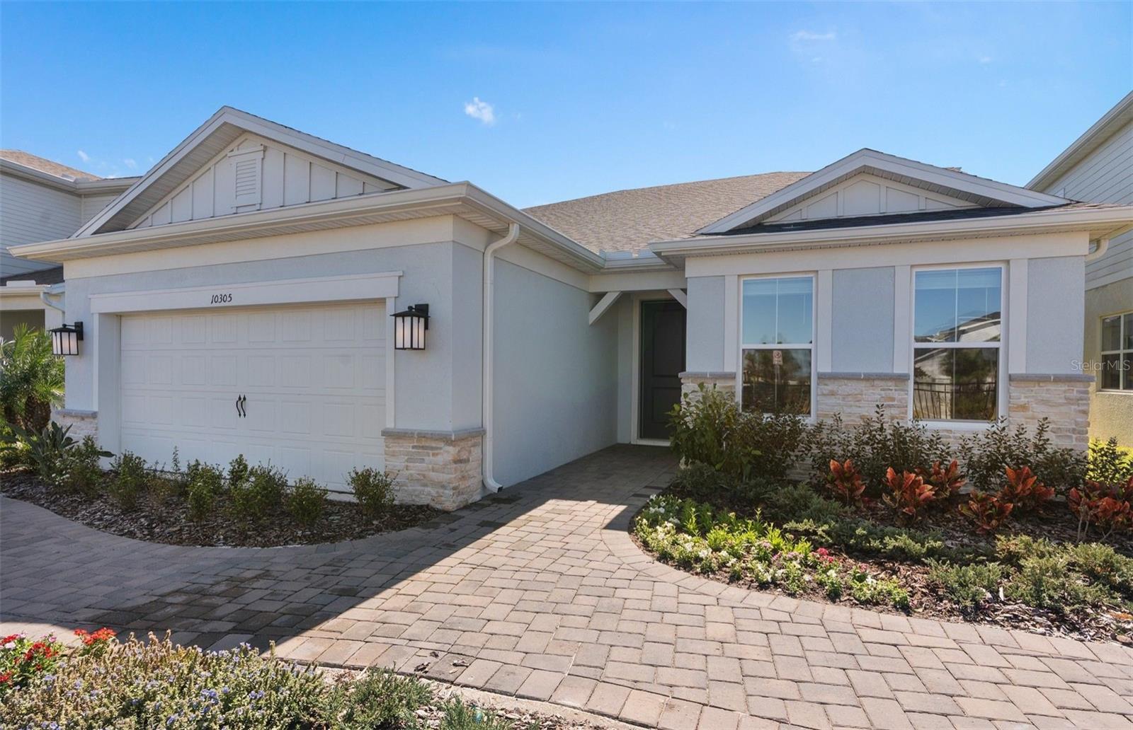 Parkview Reserve is a highly anticipated neighborhood in the heart of coveted Dr. Phillips! Located off Daryl Carter Parkway, this new construction, luxury estate-style single-family home community features private homesites with pond and conservation views, within walking distance to O-Town West, Dr. Phillips Community Park, and highly ranked schools. This natural gas community is located less than two miles from I-4, theme parks and the famous dining, shopping and entertainment of Restaurant Row – all with a low HOA and no CDD.Experience the perfect blend of luxury and convenience with Mystique Grand home. Formerly a model home, this stunning two-story residence showcases a thoughtfully designed layout with 4 spacious bedrooms, 4 full bathrooms, and an enclosed flex room ideal for a home office, media room, or additional living space. Step outside to your private outdoor oasis featuring an in-ground pool and spa, a fully equipped outdoor kitchen, and serene pond views with a beautiful fountain. The heart of the home is the open-concept kitchen, café, and gathering room, where natural light floods the space, creating a welcoming and airy atmosphere. Tall ceilings, expansive windows, and a pocket sliding glass door leading to the extended covered lanai seamlessly blend the indoor and outdoor living areas, ideal for effortless entertaining. Step outside and enjoy your backyard oasis complete with an inground pool and spa, as well as an outdoor kitchen. Inside, the gourmet kitchen is a true highlight, featuring a Whirlpool built-in natural gas cooktop, microwave, oven, and refrigerator, soft-close cabinetry, quartz countertops, and a decorative tile backsplash. A spacious walk-in pantry, single-bowl granite sink, and upgraded faucet complete this culinary space, which is both stylish and functional. The owner's suite is conveniently located on the first floor, offering a private retreat with a spa-inspired en suite bathroom that includes a walk-in shower with a built-in bench and rain shower head, dual vanity with quartz countertops, a linen closet, and an enclosed toilet for added privacy. On the first floor, you’ll also find two spare bedroom, two full bathrooms (one of which is an en suite), and an enclosed flex room that can easily serve as an office, hobby room, or guest retreat. Upstairs, the expansive loft provides additional space for leisure, and the third bedroom features its own walk-in closet and private bathroom. Throughout the home, designer-curated finishes enhance the sense of luxury, including matte black hardware, Whirlpool washer and dryer, wood-look tile flooring throughout the first floor, and plush Shaw carpet adds warmth to the upstairs bedroom and loft. This home is also equipped with the latest in home technology, including a smart thermostat, surround sound pre-wire, security system pre-wire, and LED downlights. Don’t miss the opportunity to own this beautifully designed home with unparalleled functionality and elegance. Schedule your tour today!