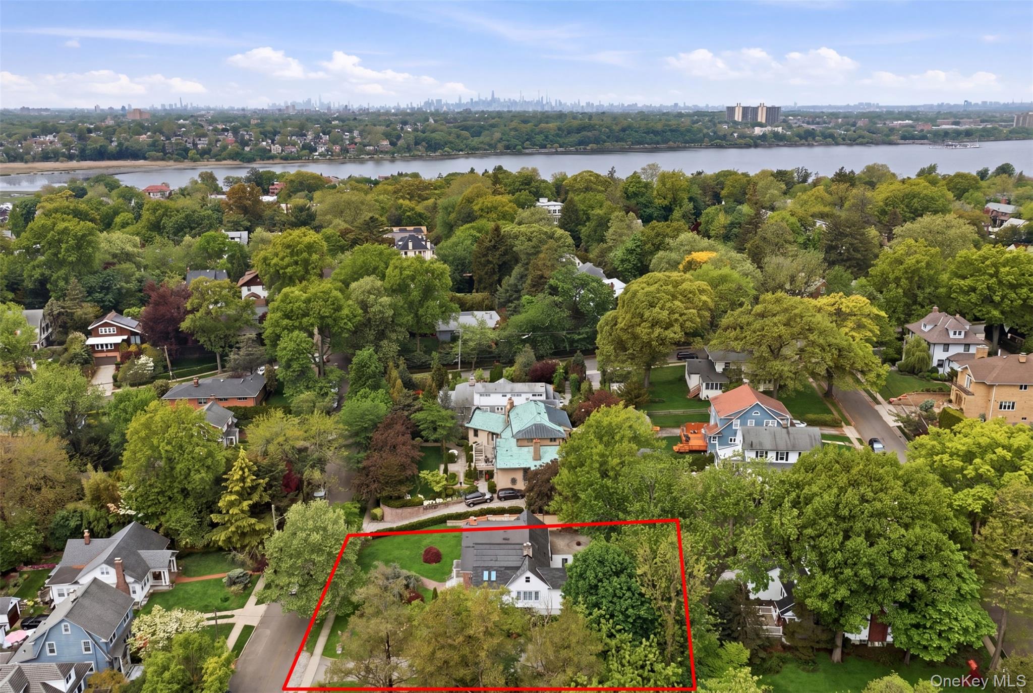 Experience the pinnacle of North Shore living in the exclusive Douglas Manor enclave. This showcase detached Cape sits on an expansive, oversized park-like property, offering a rare blend of suburban tranquility and sophisticated luxury.The ResidenceThis meticulously maintained home is designed for both grand entertaining and comfortable daily living. Key features include:Spacious Layout: 4 generously sized bedrooms and 4 full bathrooms.Main Floor: A welcoming living room, formal dining room perfect for gatherings, and an updated Eat-in Kitchen.Outdoor Living: A luxury outdoor deck and porch provide the perfect backdrop for al fresco dining, overlooking lush, manicured grounds.Finishing Touches: A unique bamboo-lined driveway leads to the residence, and a full finished basement offers versatile space for a home gym, media room, or guest suite.Exceptional Property & Community AmenitiesThe true crown jewel of this offering is the massive 121' x 121' lot. Positioned in a high-demand area, this oversized property presents a premier opportunity to enjoy a massive private estate or capitalize on the potential to build a large luxury home.Living at 319 38th Road also grants access to the prestigious community's private amenities. For approximately $900/year, the HOA provides:Security: Dedicated security patrol.Recreation: Access to a private park and private dock etc.