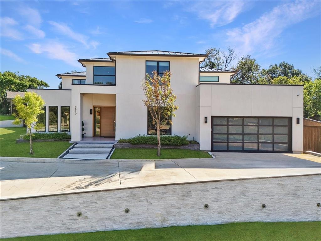 Experience the perfect blend of modern luxury and smart living in this newly built 2023 home in the sought-after University Hills community of Irving. This modern smart home blends cutting-edge technology with timeless luxury, offering 5,343 sq. ft., 6 bedrooms, and 5.5 bathrooms of thoughtfully designed living space.

Inside, soaring ceilings, open-concept layouts, and designer finishes create an inviting atmosphere. The chef’s kitchen is equipped with quartz countertops, Wolf gas range, wine cooler, custom bar with ice maker, and soft-close cabinetry — a true entertainer’s dream. Additional highlights include smart blinds, built-in speakers, motion-sensor pantry lighting, and Kohler smart toilets throughout.

This home is built for lifestyle living with a private home theater, dedicated gym, spa-inspired bathrooms with a steam shower, and spacious gathering areas. Step outside to enjoy an outdoor covered patio, balcony retreat, built-in grill, and doggie bath station — perfect for year-round entertaining.
Every detail blends luxury with convenience, from the epoxy garage flooring and mud room to the tankless water heater and foundation drip system.
Located just minutes from Las Colinas, DFW Airport, premier shopping, dining, and top-rated schools, this one-of-a-kind University Hills home offers the perfect balance of sophistication, technology, and location.