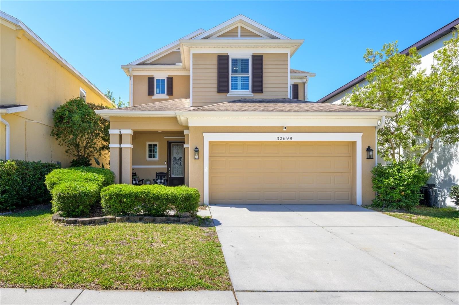 OPEN HOUSE SATURDAY 4/25 FROM 1-4:00.   Come see this beautiful upgraded 4-bedroom, 2.5-bath home in the highly sought-after Watergrass community, perfectly positioned in the heart of Connected City—one of Wesley Chapel’s fastest-growing and most desirable areas. This move-in ready home offers an ideal blend of modern upgrades, privacy, and convenience, located just a short distance from Watergrass’s resort-style amenities including the pool, clubhouse, tennis courts, parks, green spaces, gym, and more—bringing everyday luxury right to your doorstep. A large covered front porch welcomes you into a bright open-concept layout featuring plantation shutters throughout the ENTIRE home, upgraded lighting, and stunning wood-grain and tile flooring downstairs. The spacious kitchen flows seamlessly into the living and dining areas, perfect for entertaining, and includes newer appliances such as a dishwasher and microwave. A versatile first-floor flex space with French doors can easily function as a home office, guest suite, formal dining area, play space,  or 5th bedroom. Additional highlights include a NEW A/C (2026) with smart thermostats, professionally cleaned air vents (2026), upgraded garage flooring, and thoughtful upgrades throughout. Go outside to a screened lanai and enjoy added privacy with no front or rear neighbors—a rare find that enhances the home’s sense of tranquility. Conveniently located across the street to Watergrass Elementary School with access to multiple A-rated schools, and just minutes from everyday essentials like Chick-fil-A, Publix, and Starbucks, as well as close proximity to the iconic Epperson Lagoon for weekend fun and entertainment. Enjoy easy access to major highways, shopping, dining, and Tampa-area attractions while experiencing the best of Watergrass living in Connected City, where convenience, community, and comfort come together effortlessly. Schedule your private showing today—this one stands out from the rest!