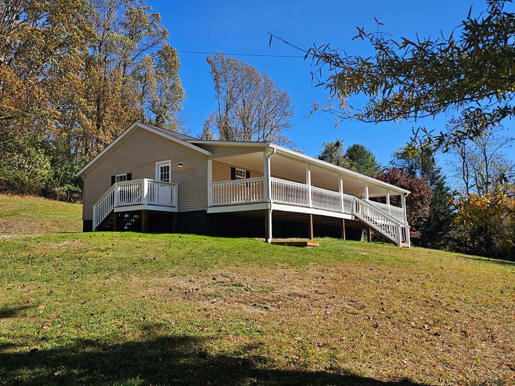 Beautifully Remodeled 3-Bedroom, 2-Bath Home on 1.56 Acres! This spacious home has been completely updated with modern touches throughout, including a new roof, heat pump, and luxury vinyl plank flooring. Enjoy a large living room and cozy den, perfect for relaxing or entertaining. The updated kitchen features new appliances, cabinets, and a stunning island with a butcher block top. The large master suite includes a soaking tub, new vanity, and walk-in closet, while two additional bedrooms and a full bath offer plenty of space for family or guests. Step outside to the covered front porch, ideal for quiet mornings or evening gatherings. Nestled on a private 1.56-acre lot, this home offers peace and tranquility while being just minutes from the City of Galax, New River Trail, and Blue Ridge Parkway. Call today to schedule your showing—this move-in-ready home won't last long!