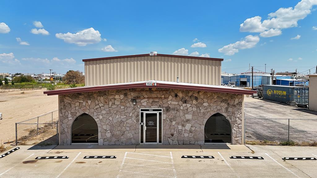 4,100 SF industrial building on Kermit Hwy in Odessa featuring 800 SF of updated office and 3,300 SF of shop space. Includes a 2-ton OH bridge crane, two drive-in bays with 16' and 10' doors, fully fenced and stabilized yard with automatic gate, asphalt parking, and covered compressor station. Excellent visibility and quick access to W Loop 338.